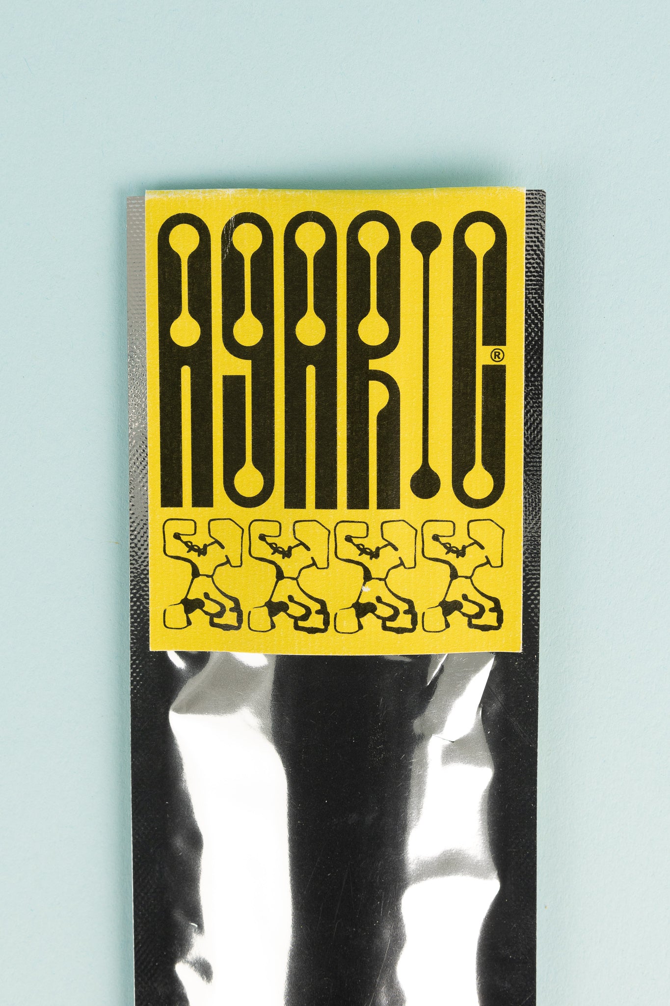 Earthship Incense packaging by Agaric featuring a bold yellow design with unique patterns.