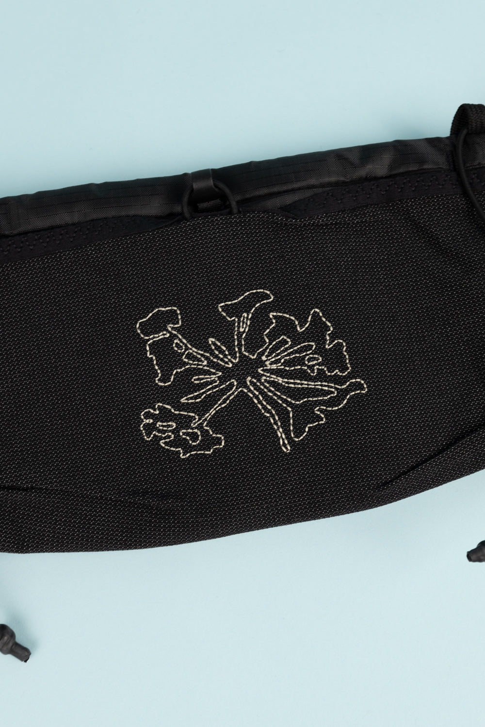 Portal Borders Cargo Belt - Black Beauty showing a black fabric with embroidered design.