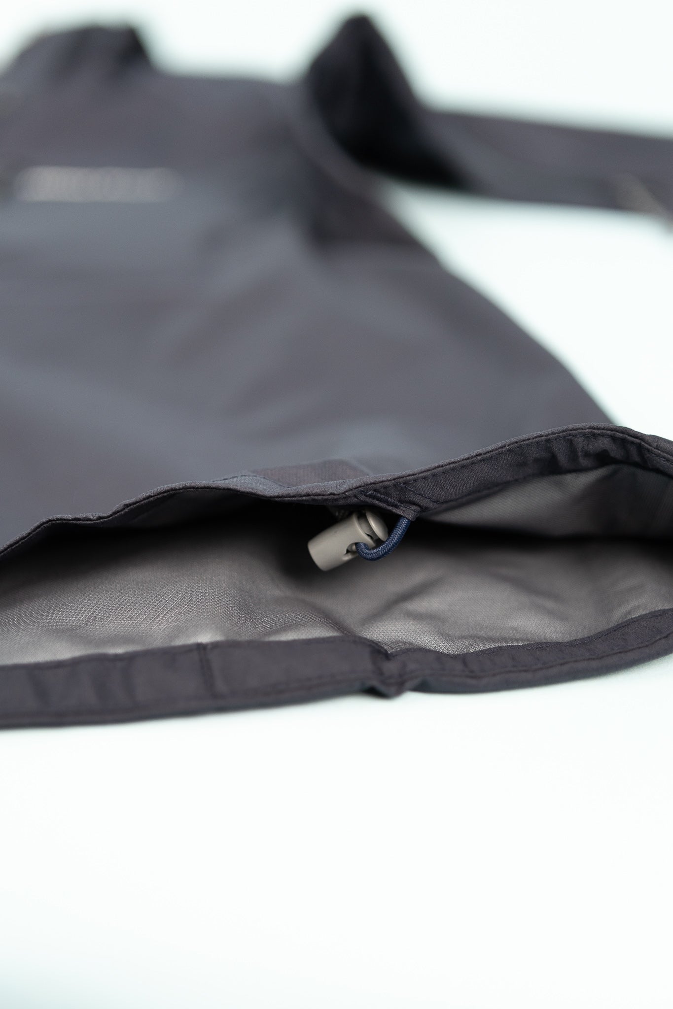 Montbell US Women's Tempest Jacket showing interior details and fabric quality in navy color.
