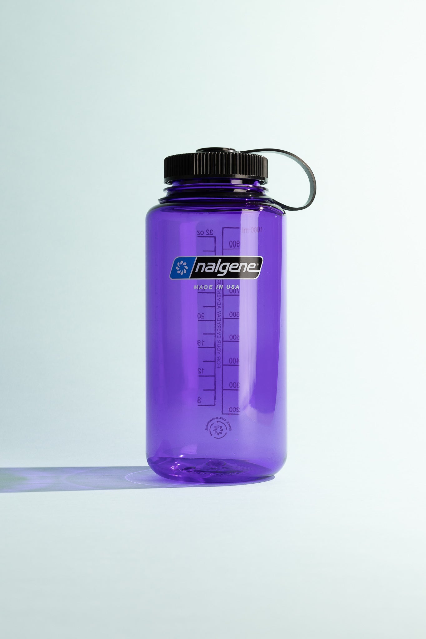 Sustain W/M 1L - Purple Nalgene water bottle with measuring markings and a screw cap for hydration on the go.