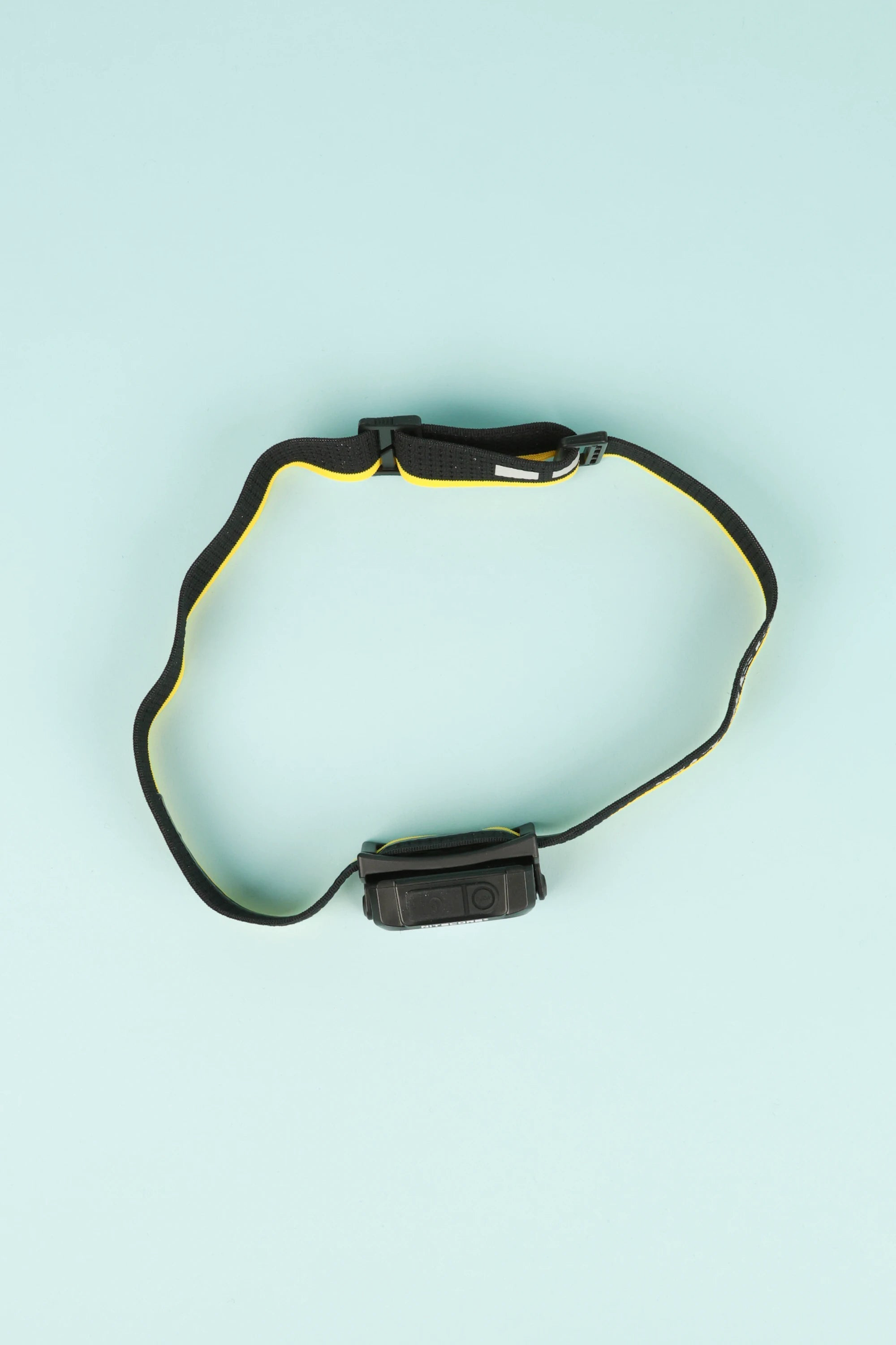 Nitecore NU25 MCT 400L - Yellow headlamp with elastic headband on light blue background.