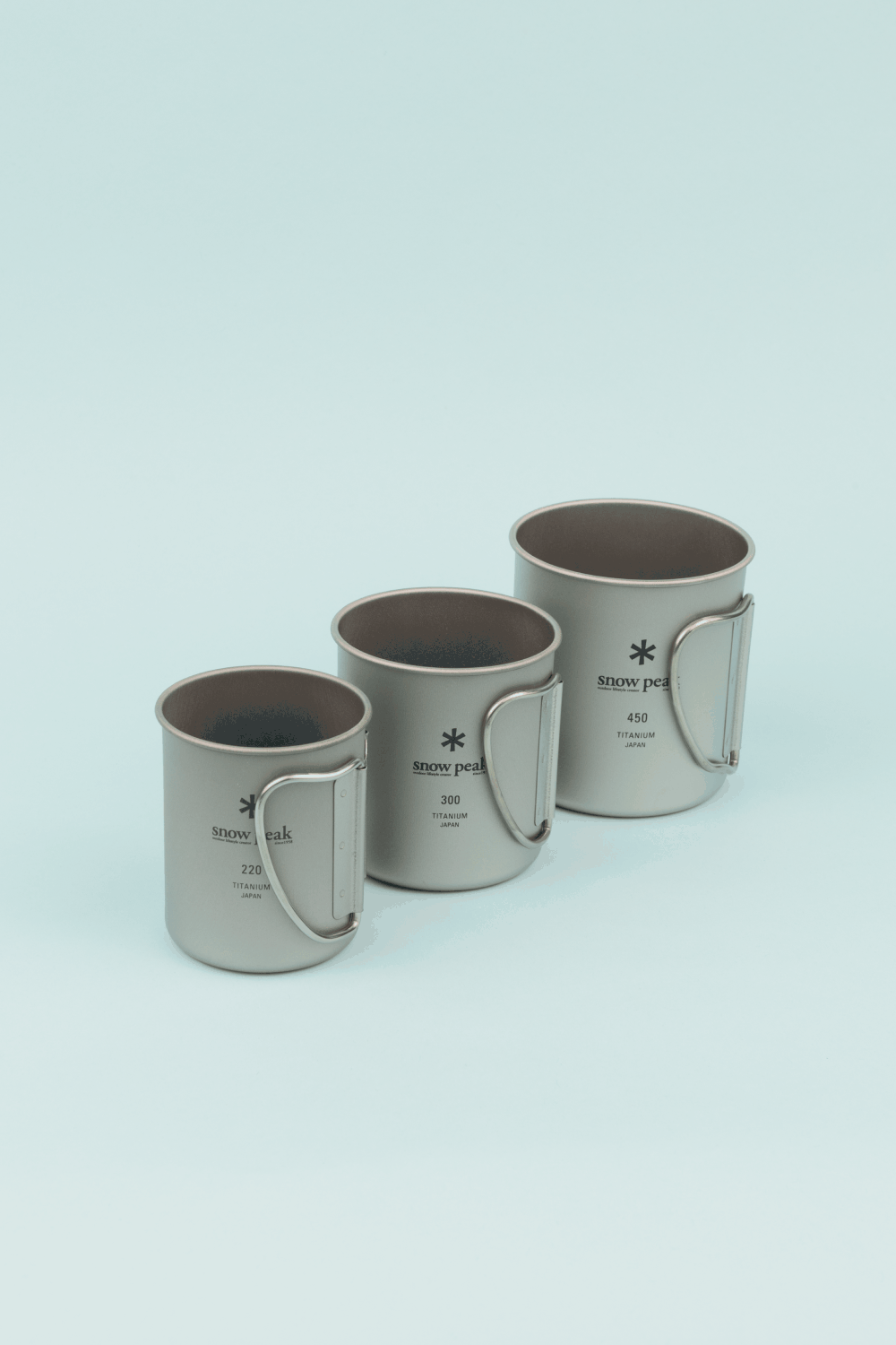 Snow Peak Single Wall Titanium Nesting Cup Set featuring three titanium mugs of varying sizes: 220, 300, and 450.