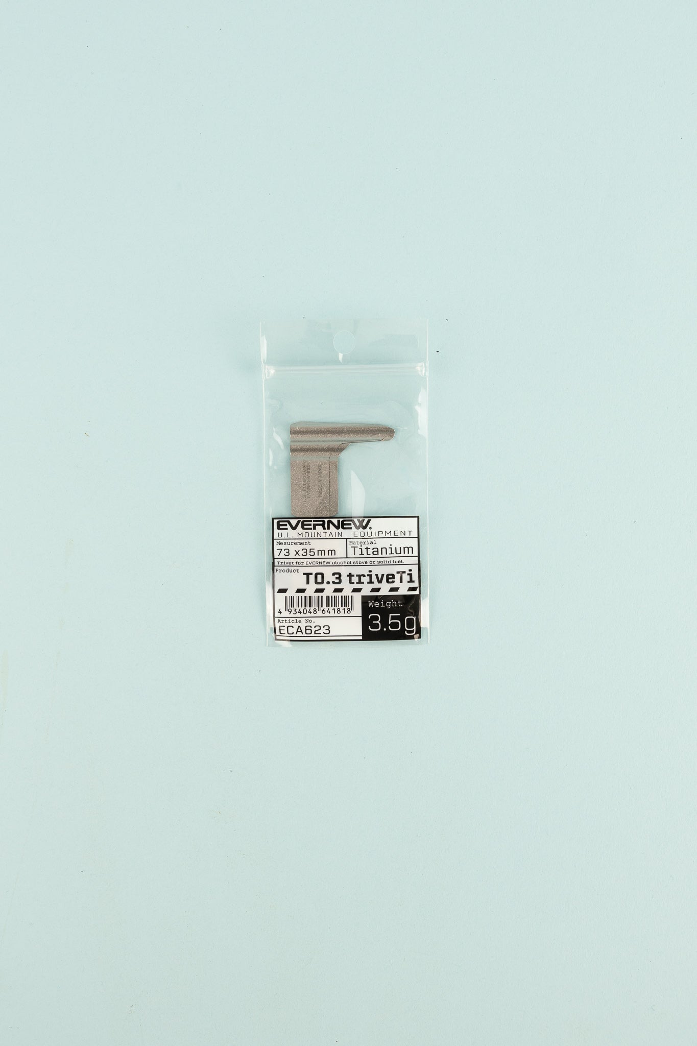 Evernew T0.3 TriveTi titanium accessory in packaging on light blue background.