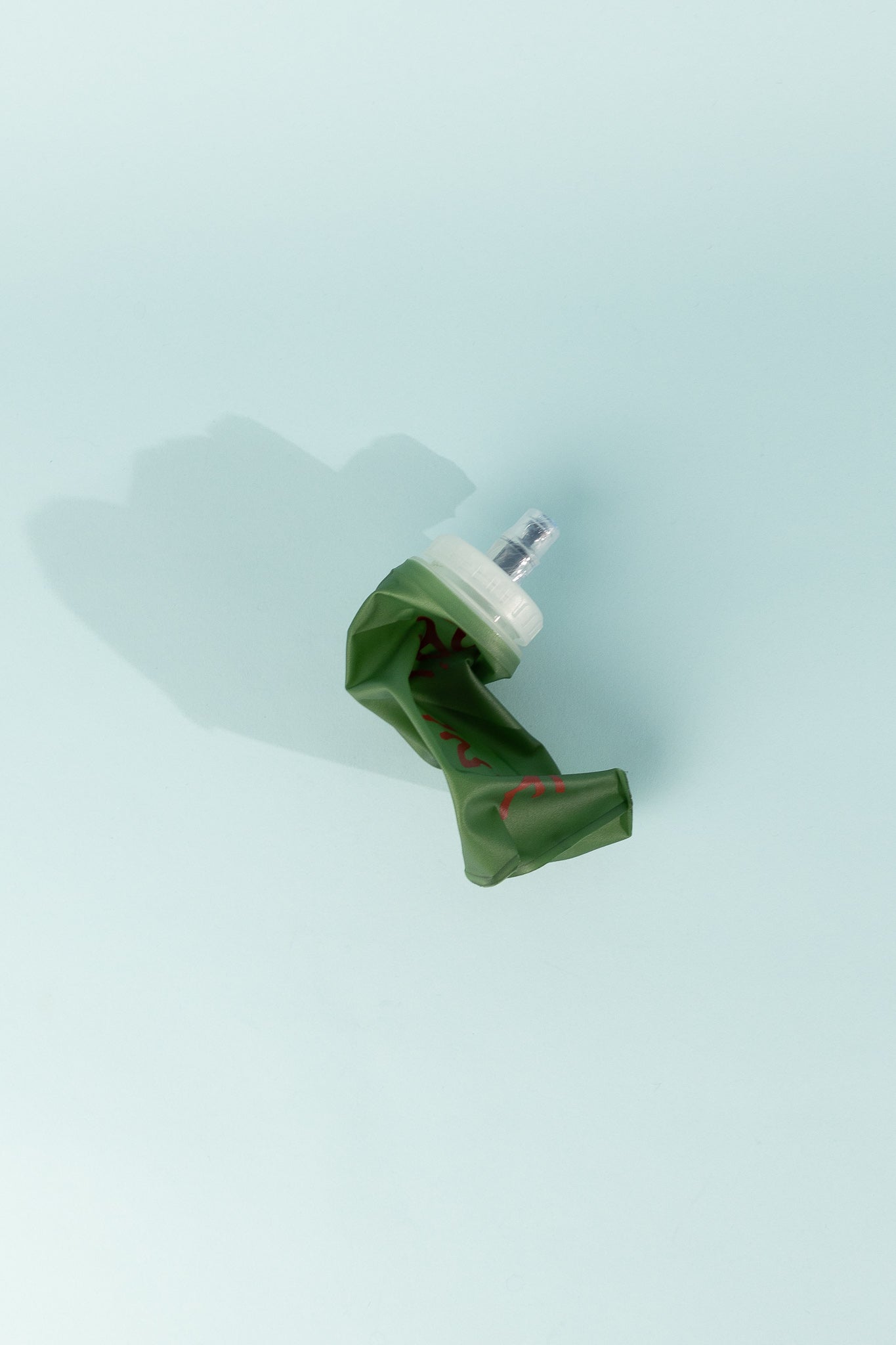 Floppy Water Bottle in green, collapsible design for easy storage and portability.