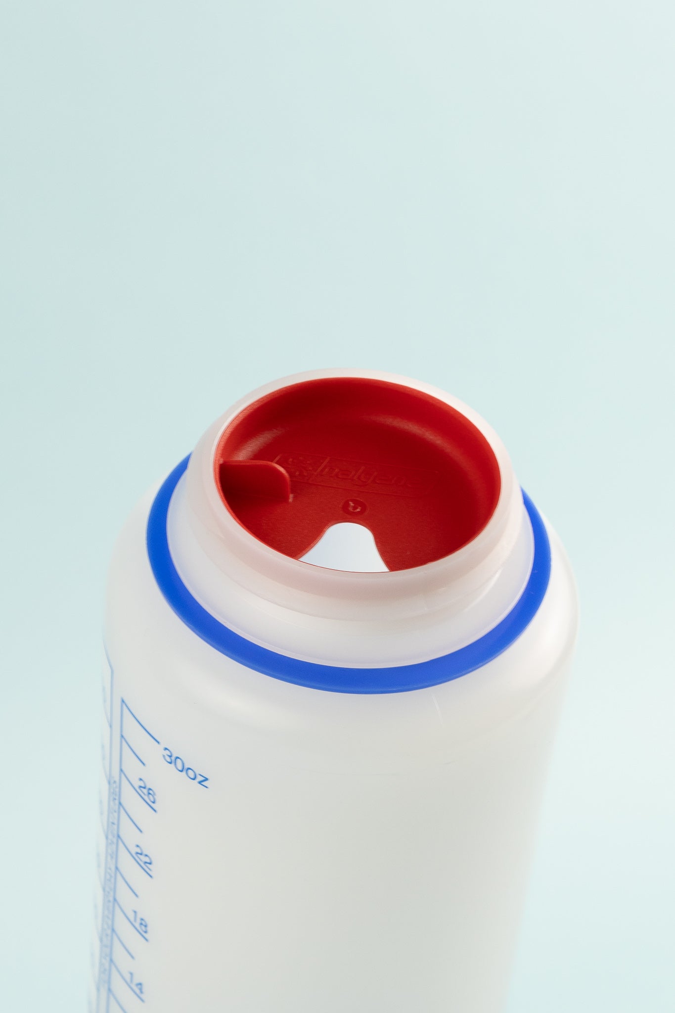 Top view of Easy Sipper - Red attached to Nalgene 1L Wide Mouth Bottle for easy sipping.