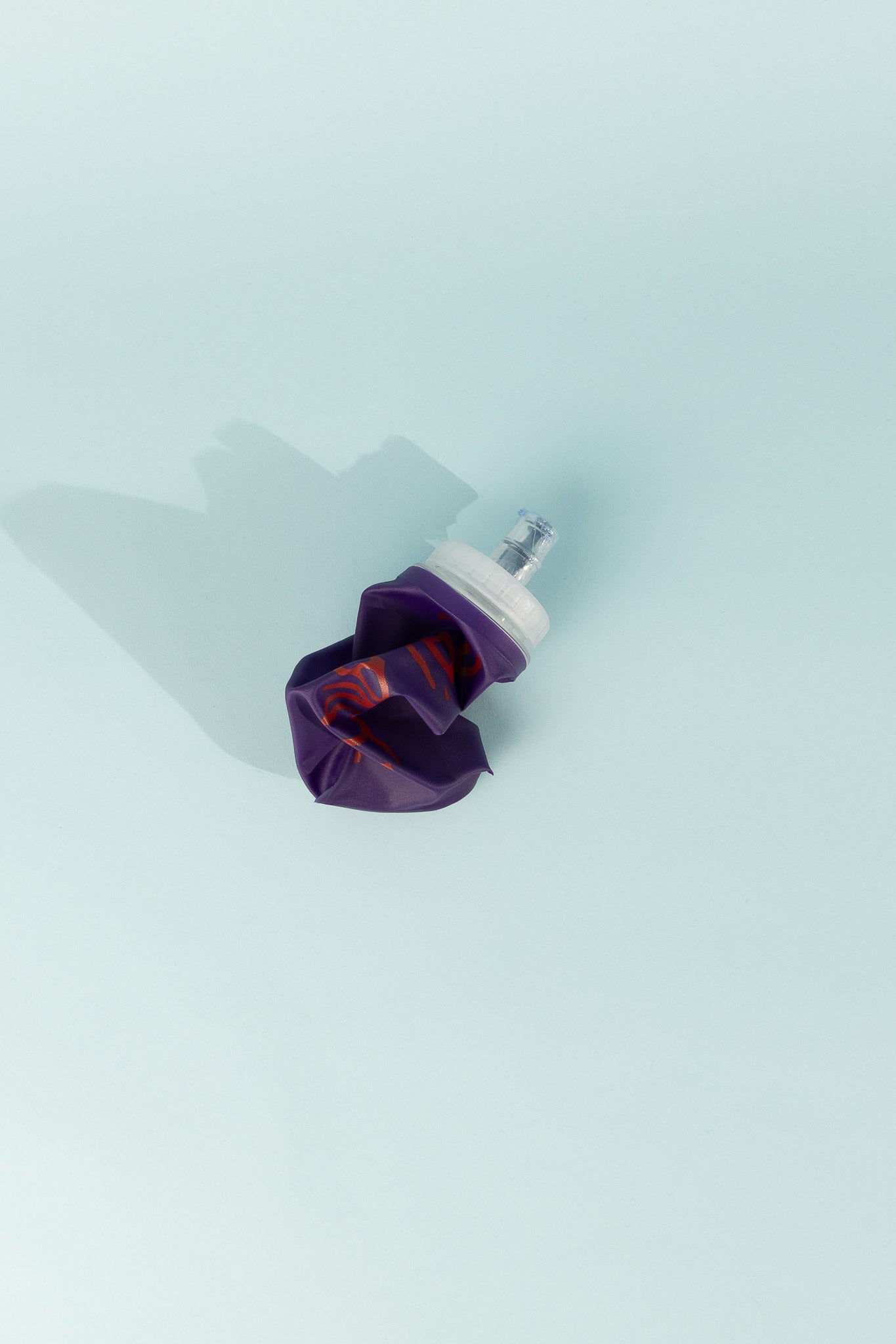 Floppy Water Bottle in purple color, collapsible design, perfect for travel and outdoor use.
