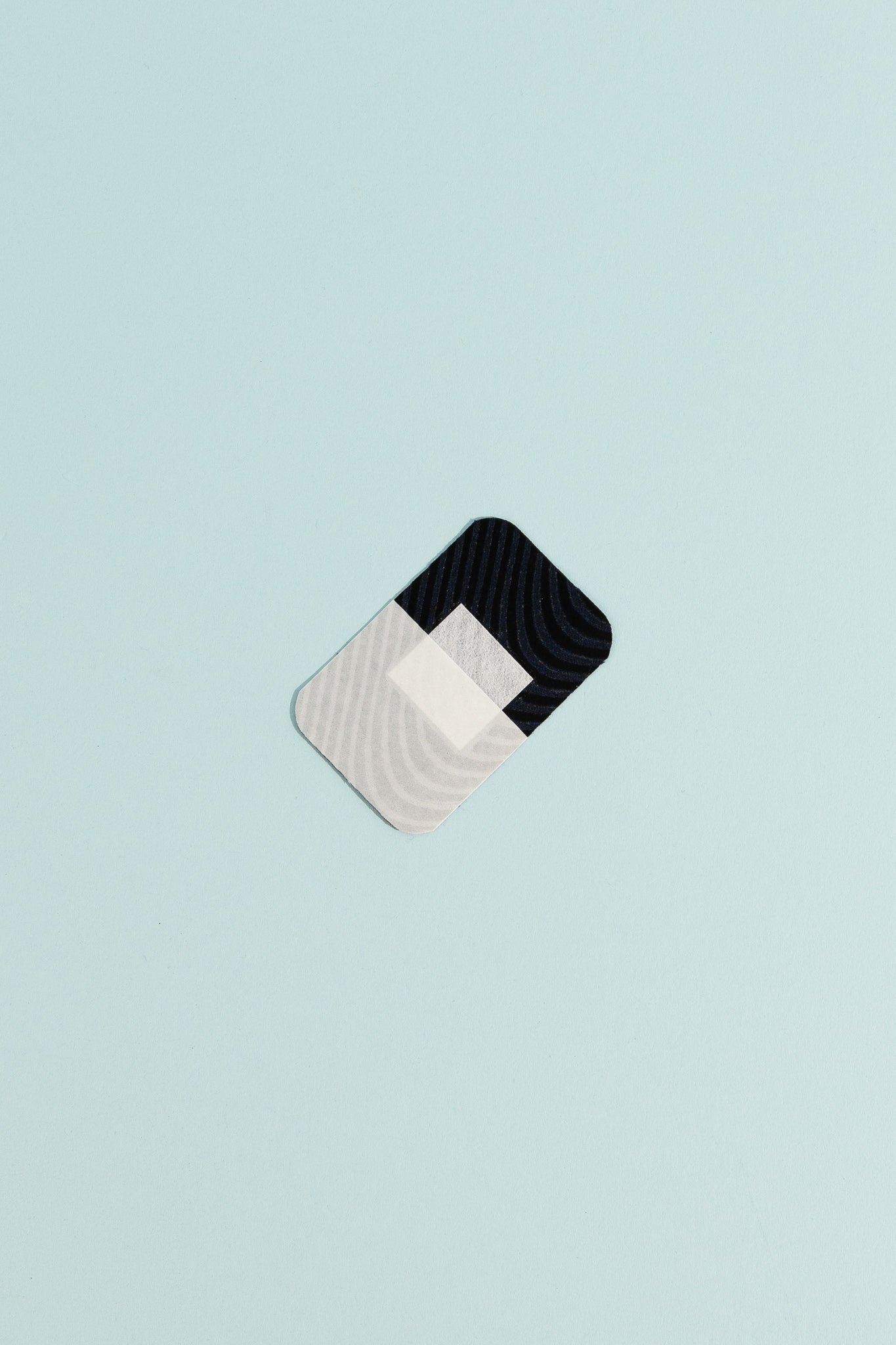 Merino Wool Adhesive Bandages on a light blue background, showcasing gentle and biodegradable first aid.