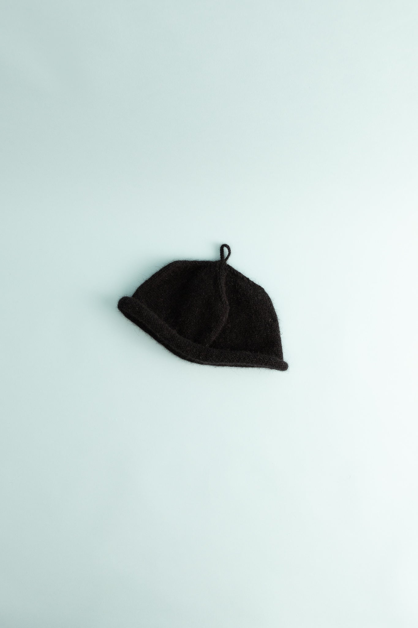 Loop Hat - Black, handknitted beanie made with soft possum merino yarn, designed for warmth and comfort.