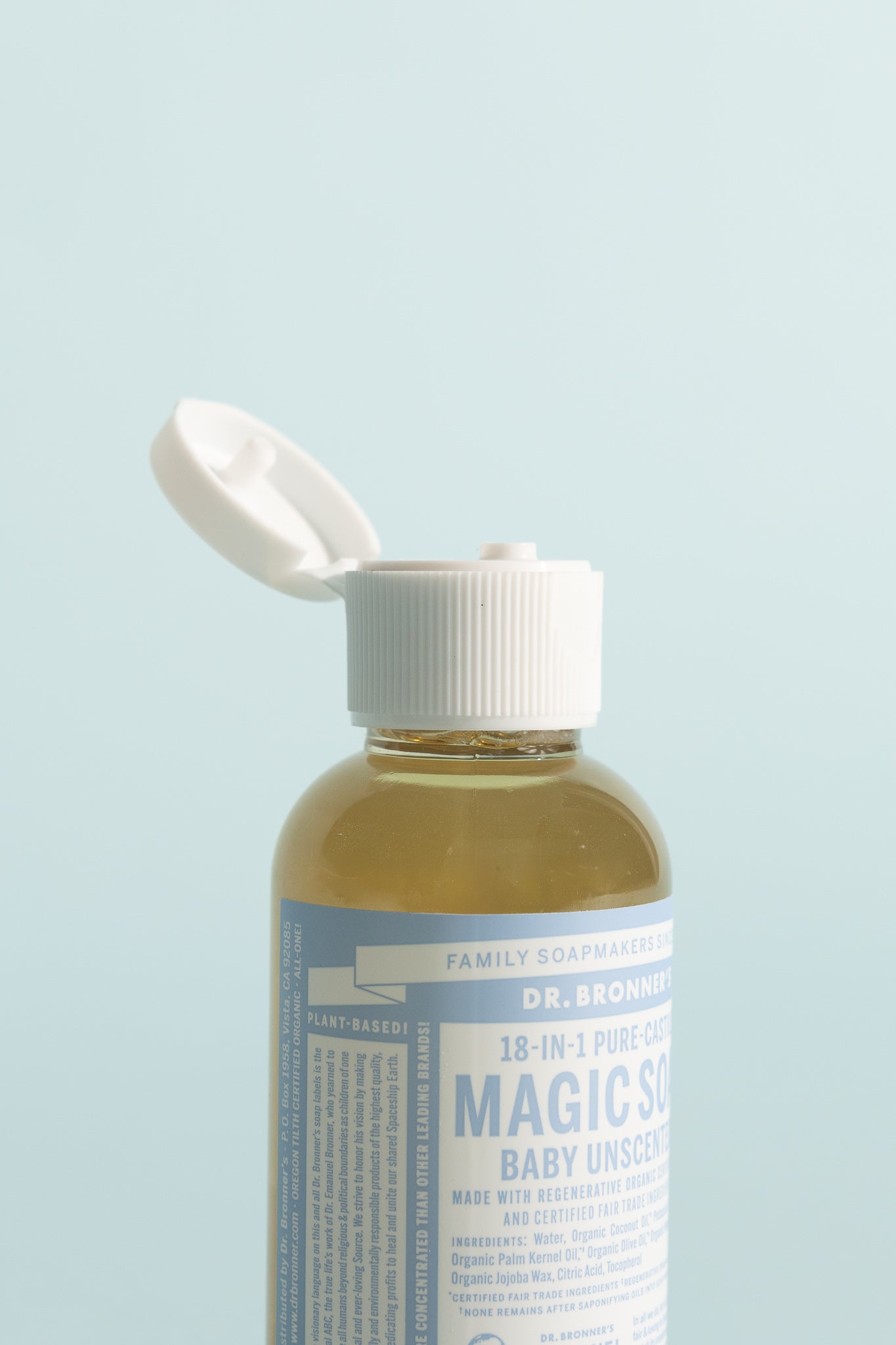 Unscented Pure-Castile Liquid Soap 59ml bottle with cap open, ideal for sensitive skin and versatile uses.