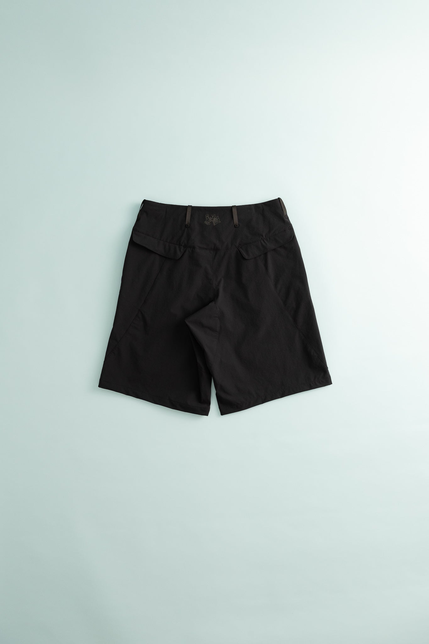 Back view of Traka Softshell Short - Black Beauty for hiking and everyday use.