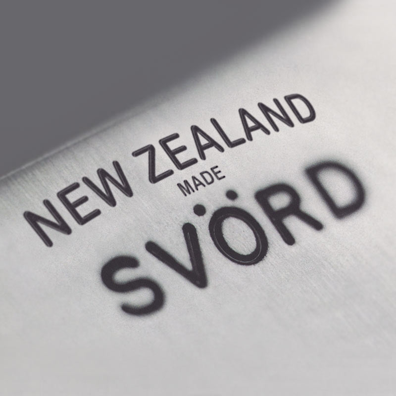 The brand marking on a knife showing 'NEW ZEALAND made SVÖRD' for quality craftsmanship.