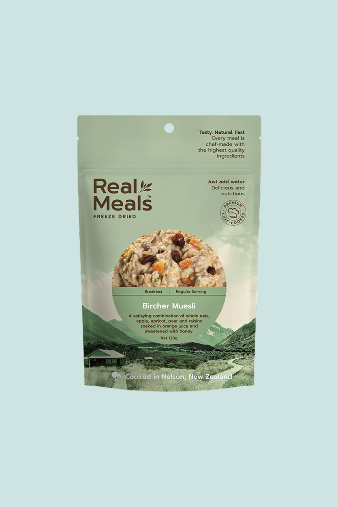 Real Meals Bircher Muesli packaging featuring freeze-dried oats, fruits, and cooking instructions on a light background.