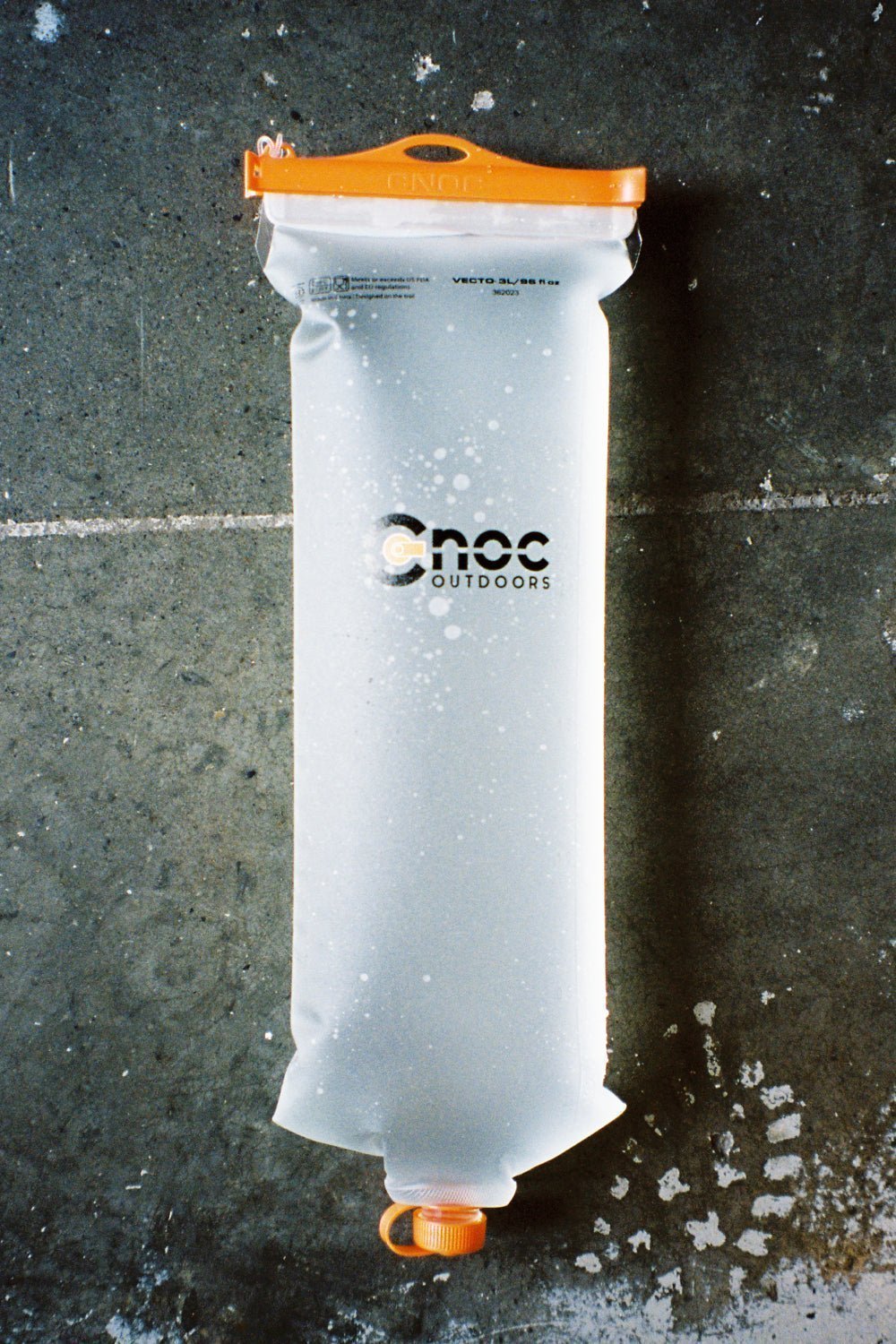 CNOC Vecto 3L Water Bladder 28mm Thread on a concrete surface.