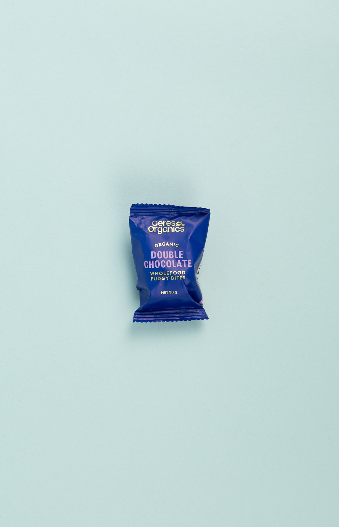 Ceres Organics Organic Wholefood Fudgy Bites - Double Chocolate packaging on a light blue background.