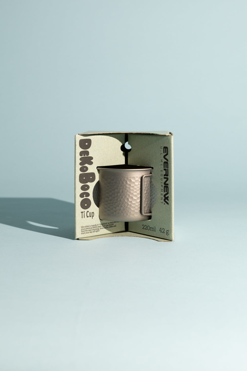 Evernew Dekoboco Titanium Cup in packaging, showcasing its hammered design and lightweight properties.