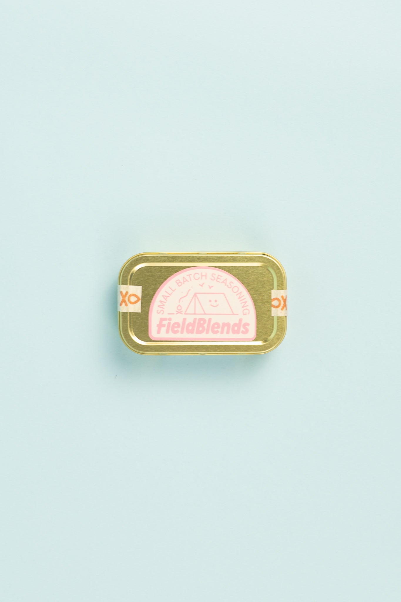 Field Blends Pink Peppercorn, Sea Salt & Garlic camping tin on a light background.