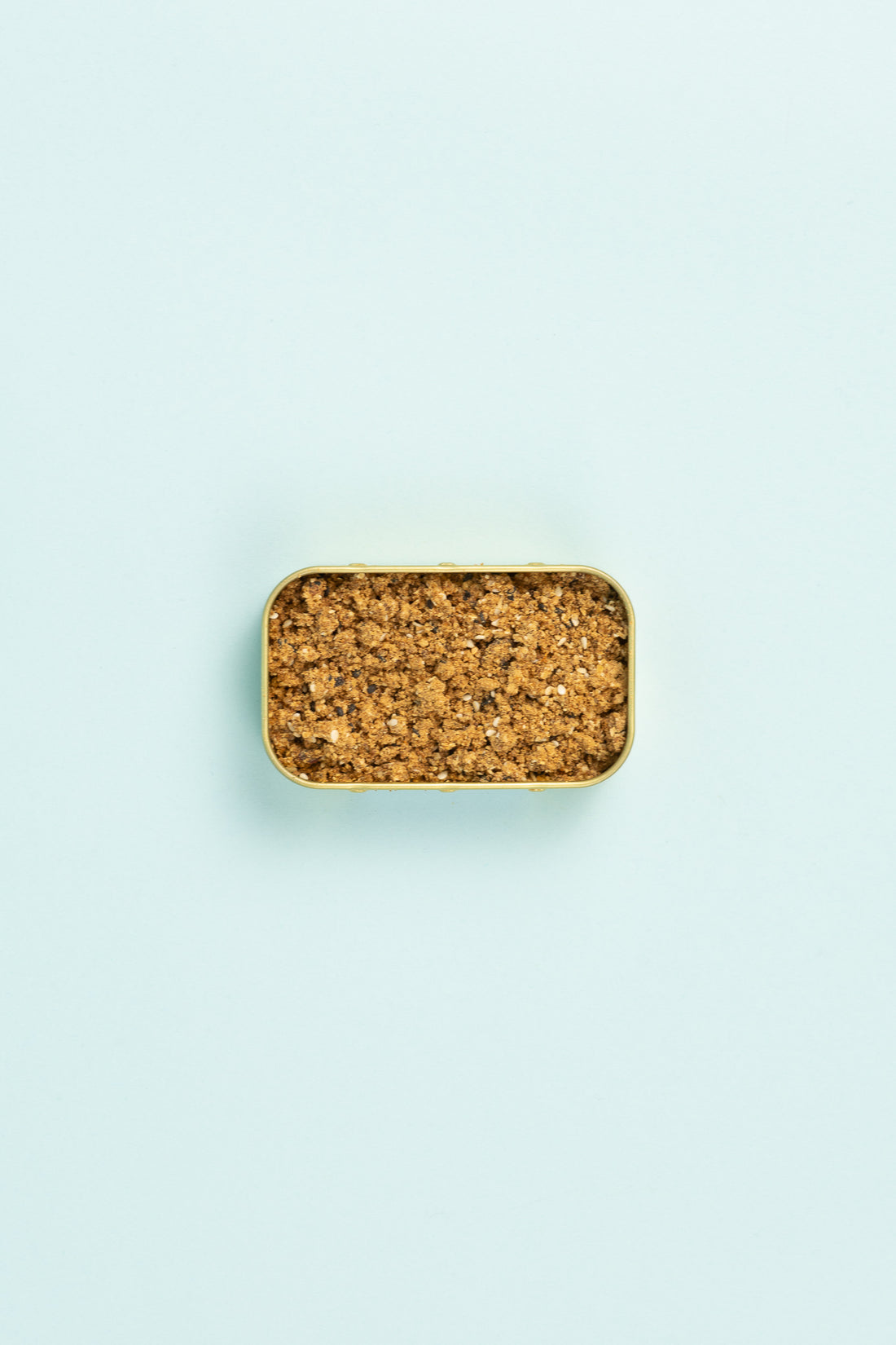 Field Blends Soy, Ginger & Sesame - Camping Tin filled with aromatic seasoning on a pastel background.
