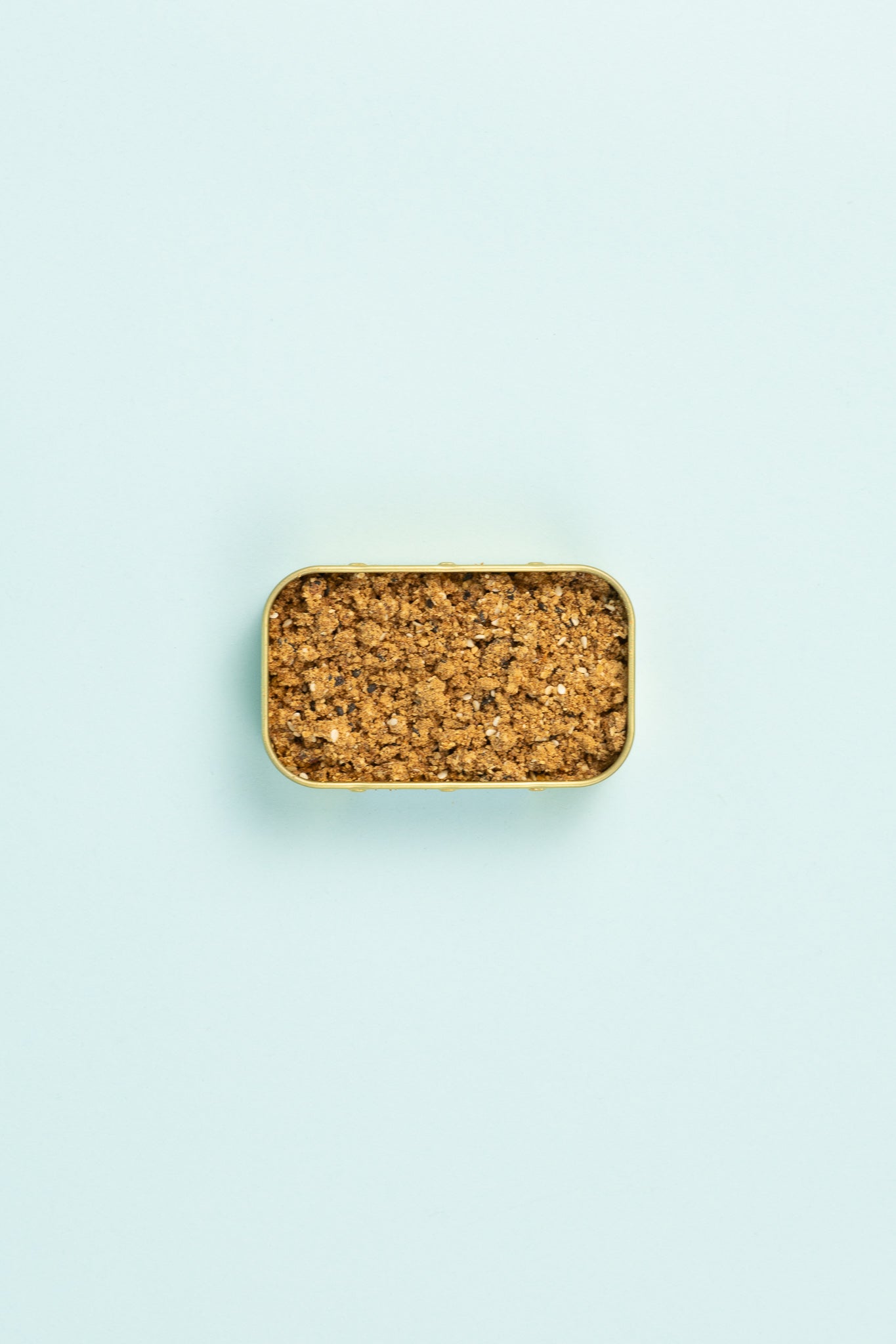 Field Blends Soy, Ginger & Sesame - Camping Tin filled with aromatic seasoning on a pastel background.
