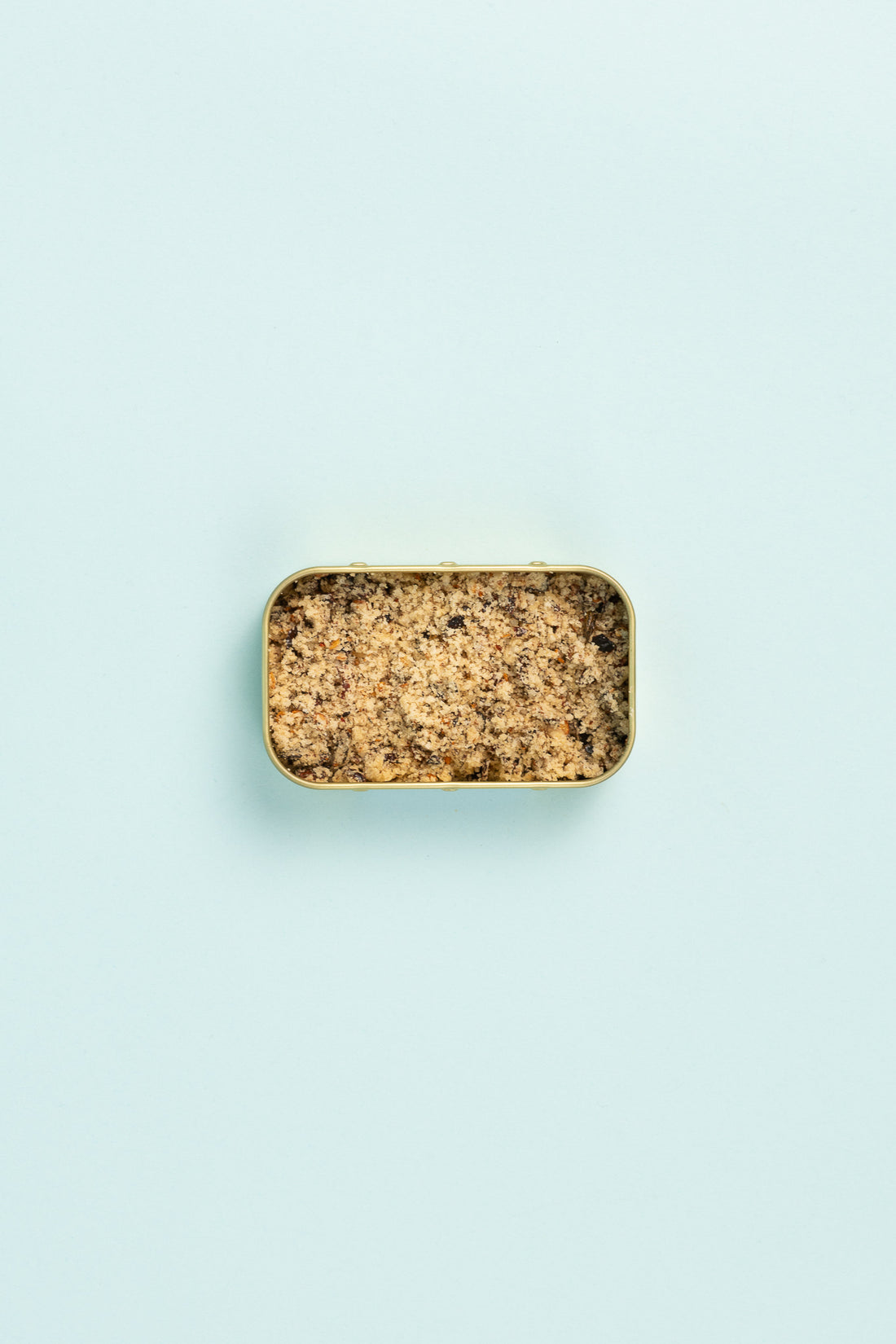 Field Blends Maple Chilli Salt in a camping tin on a light blue background.