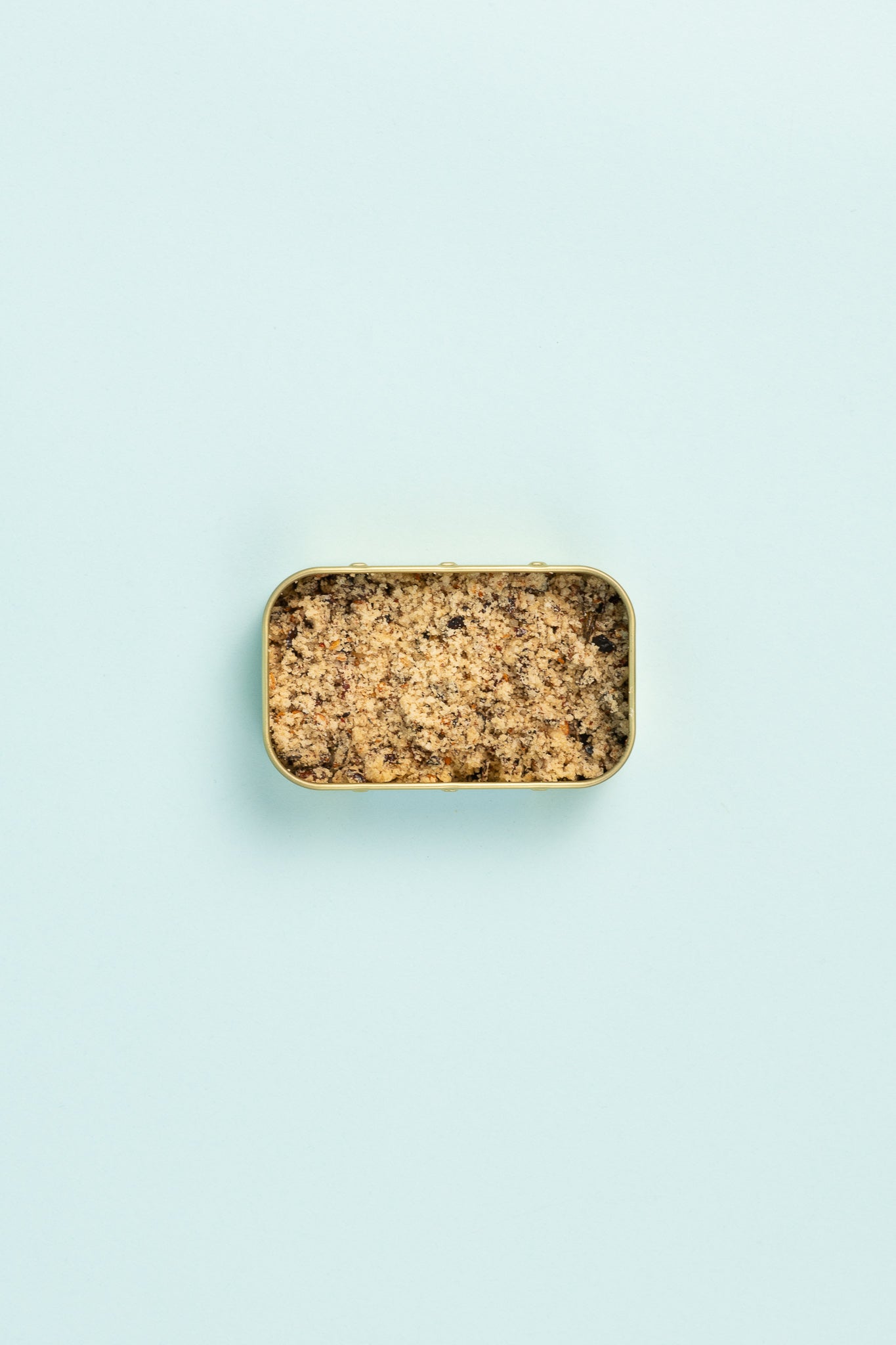 Field Blends Maple Chilli Salt in a camping tin on a light blue background.
