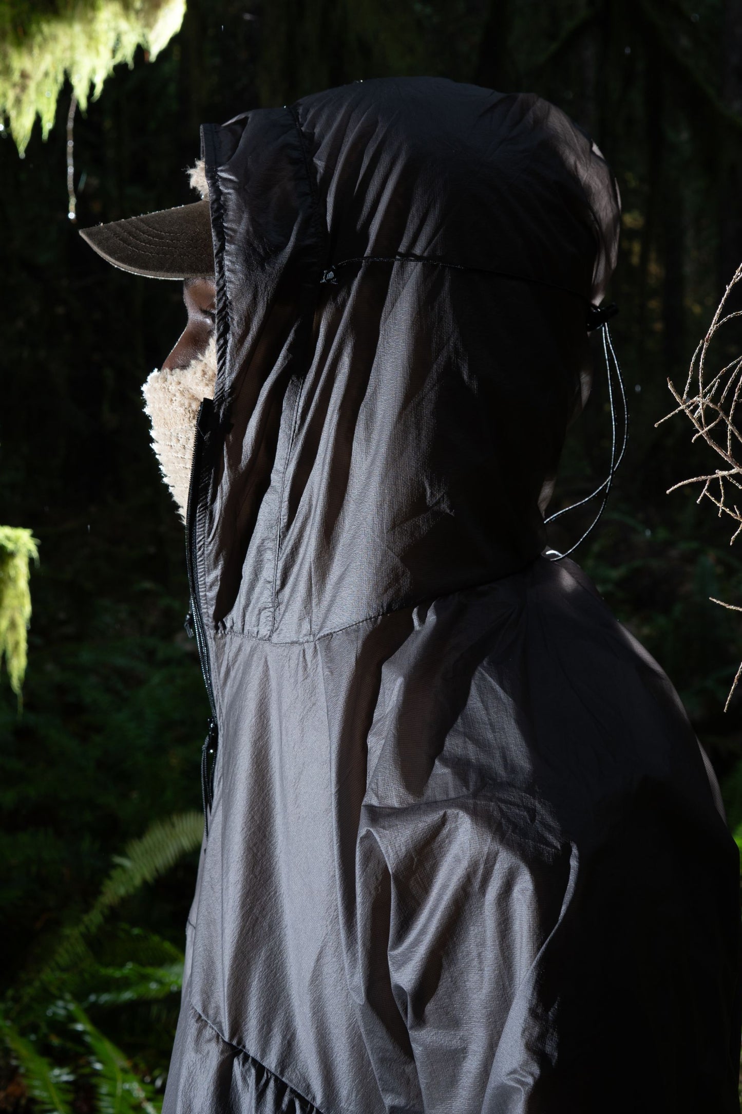 Gnuhr Breaker Wind Shirt v1.5 in Iron, showcasing its lightweight hooded design for wind protection.