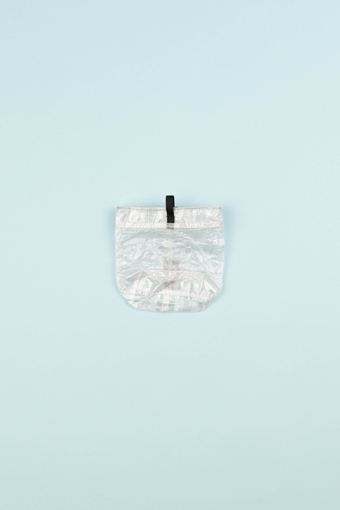 Allmansright Krafs Stuff Sack Small in white color, featuring ultralight Dyneema fabric and a convenient pull tab.