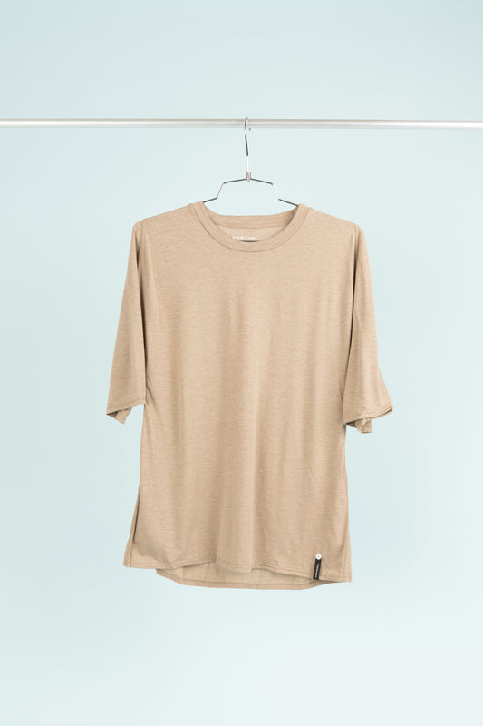 Portal Drift Merino Tee in Desert Taupe showcasing an ergonomic fit, made of soft merino wool and durable nylon.