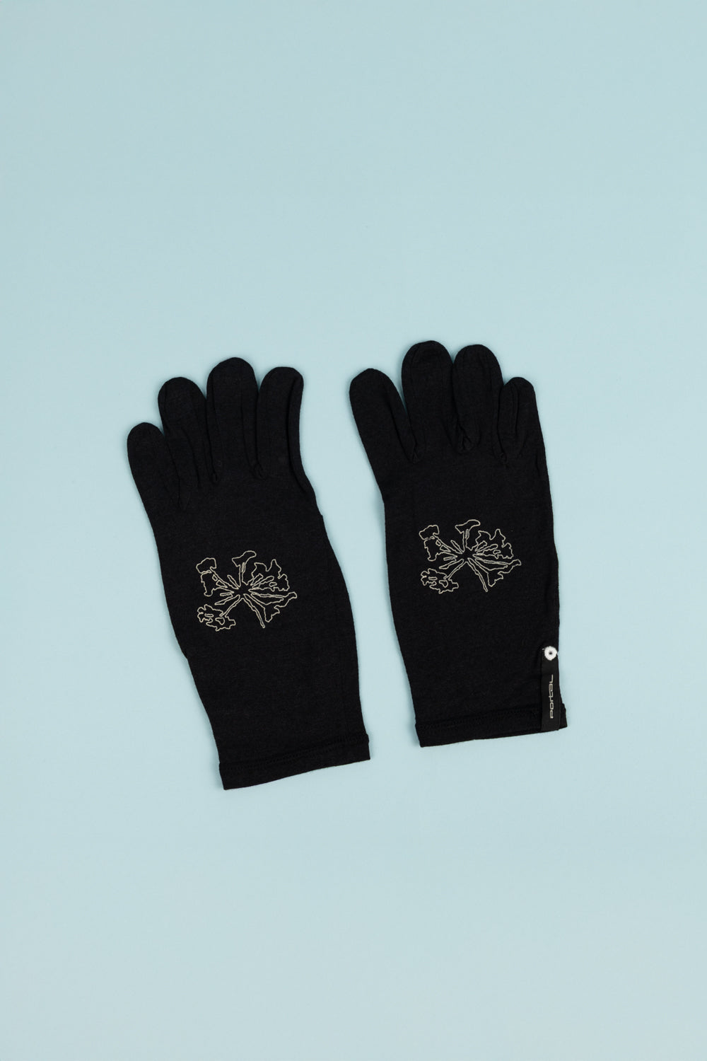 Portal Drift Merino Gloves in black with unique design, perfect for cold weather activities like running and hiking.