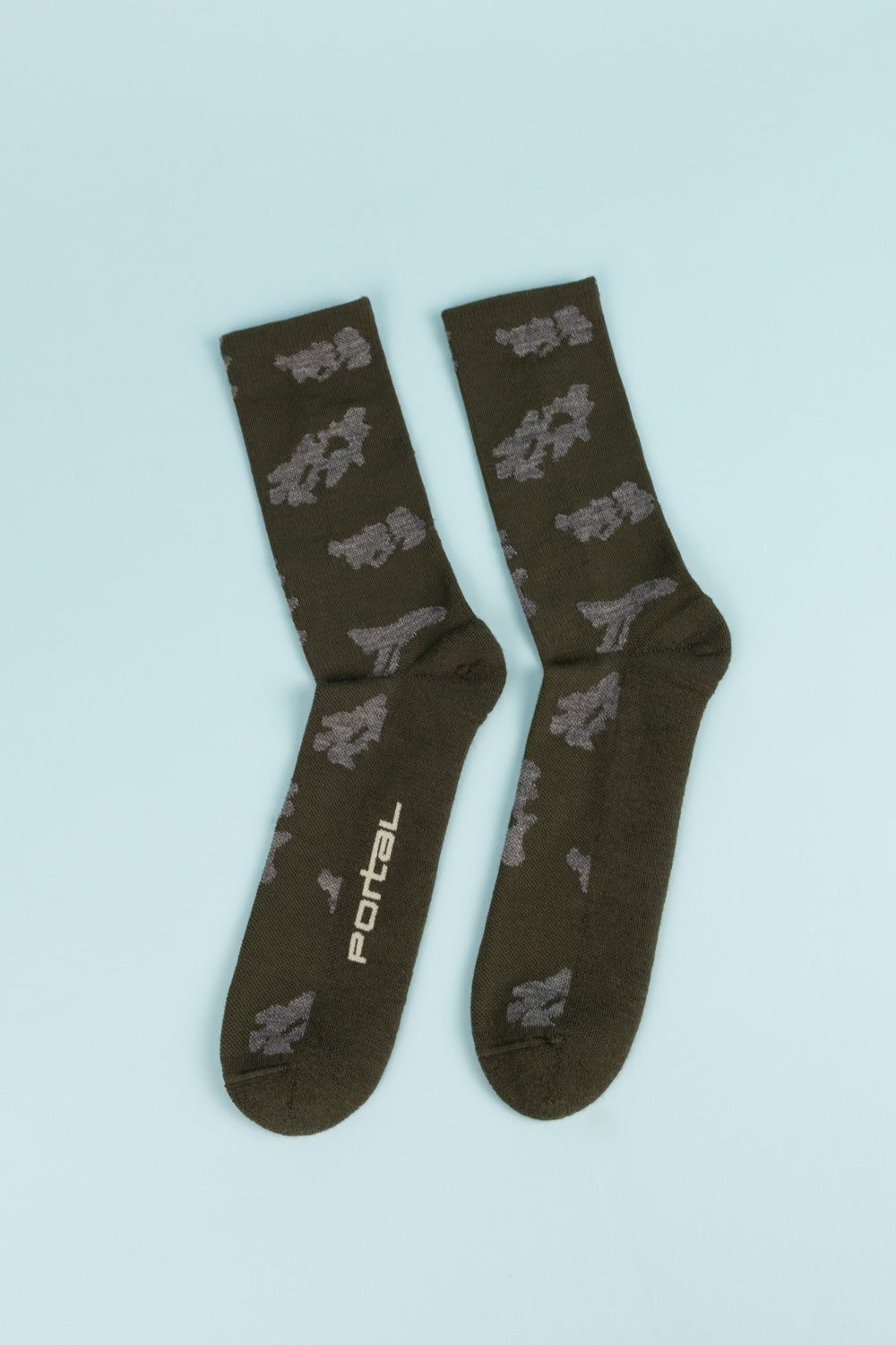Portal Ritual Merino Socks in Dark Olive, featuring a blend of merino wool, ideal for running, hiking, and everyday wear.