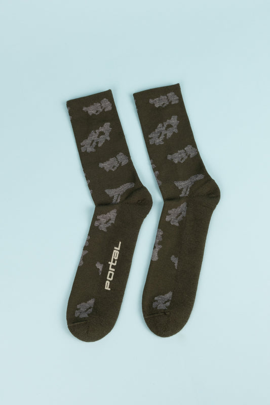 Portal Ritual Merino Socks in Dark Olive, featuring a blend of merino wool, ideal for running, hiking, and everyday wear.