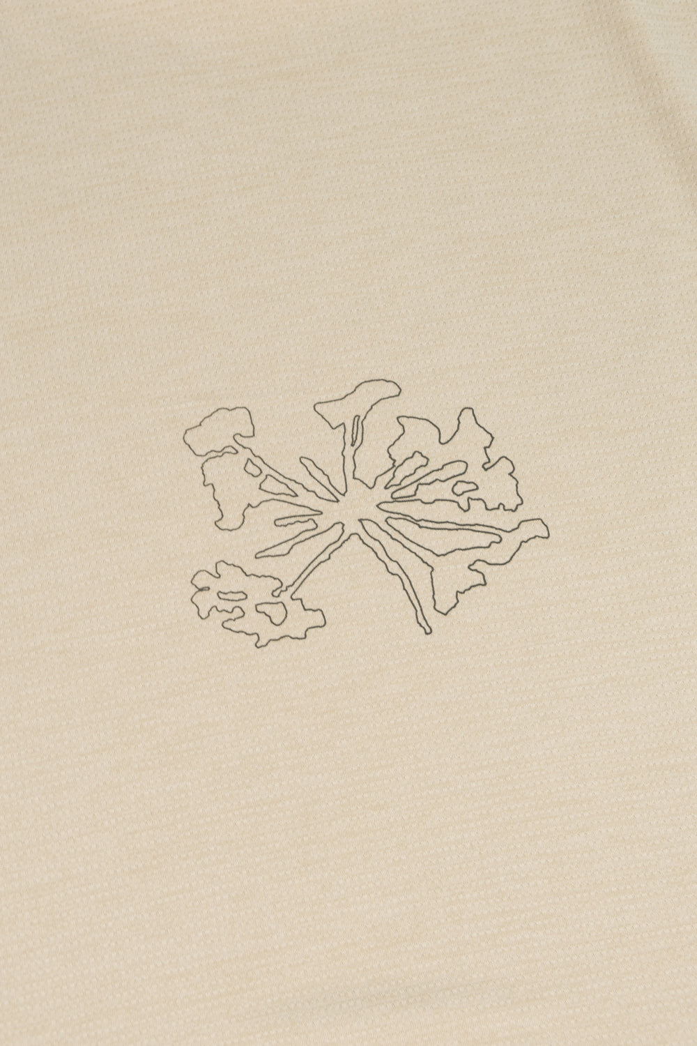 Artistic design of a plant motif on the Portal Lateral Peak Tee in Bone White, showcasing its unique style.