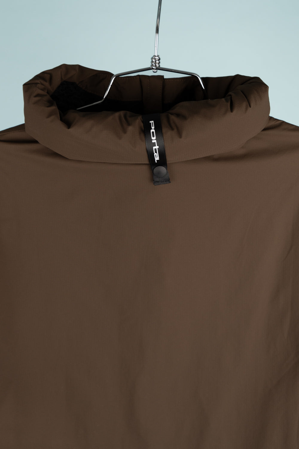 Portal Level Alpha Jacket in Slate Black showcasing the insulated collar design and hanger display.