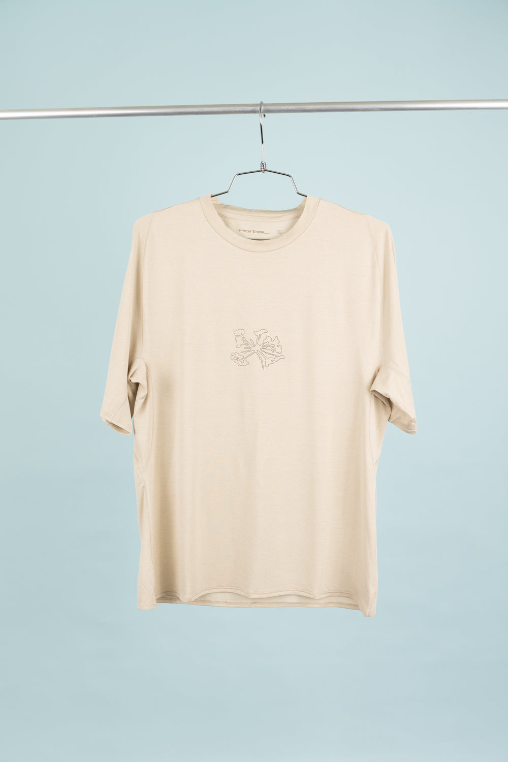 Portal Lateral Peak Tee in Bone White, a unisex technical t-shirt designed for hiking and running.