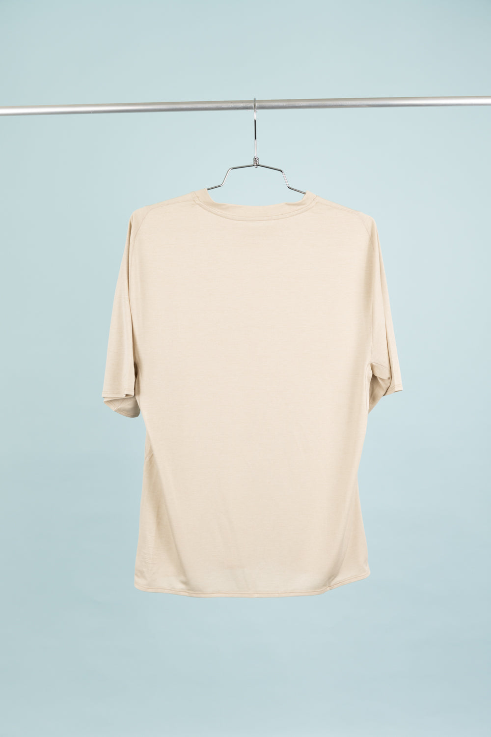 Back view of the Portal Lateral Peak Tee in Bone White, a technical t-shirt designed for hiking and running.