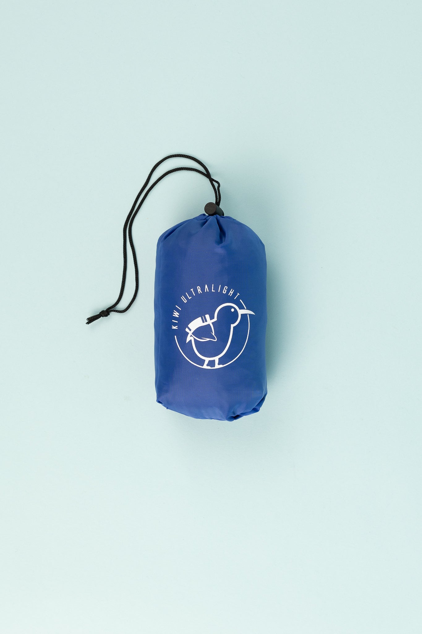 Kiwi Ultralight Sleeping Pad Fitted Sheet packed in a blue pouch with a logo, ready for outdoor adventures.