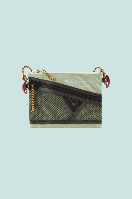 Klattermusen Algir Accessory Bag Small in Sea Foam color with mesh pocket and adjustable strap.