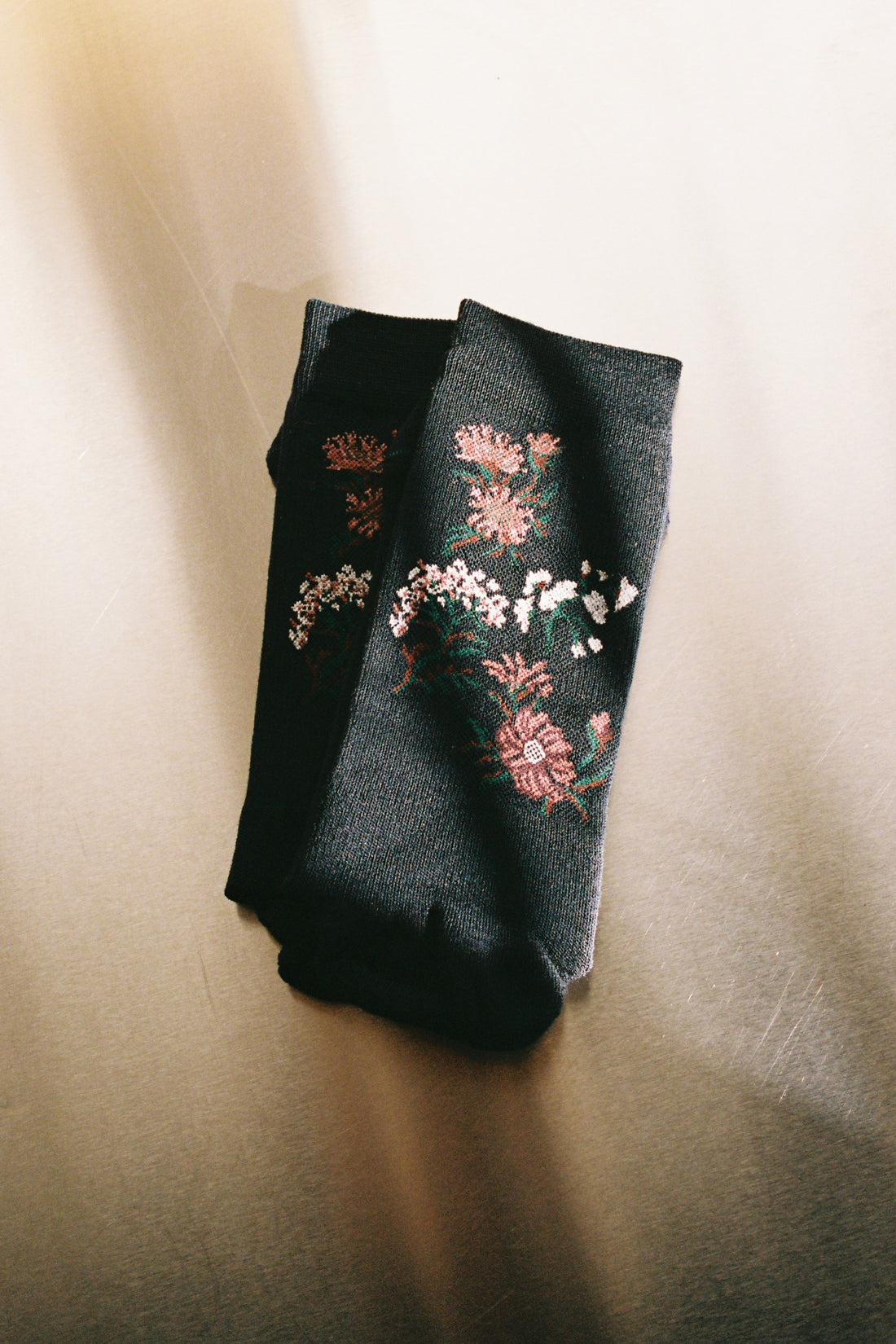 Laceflower Flower Of The Mountain Hiking Socks - Navy displayed on a light background with floral designs.