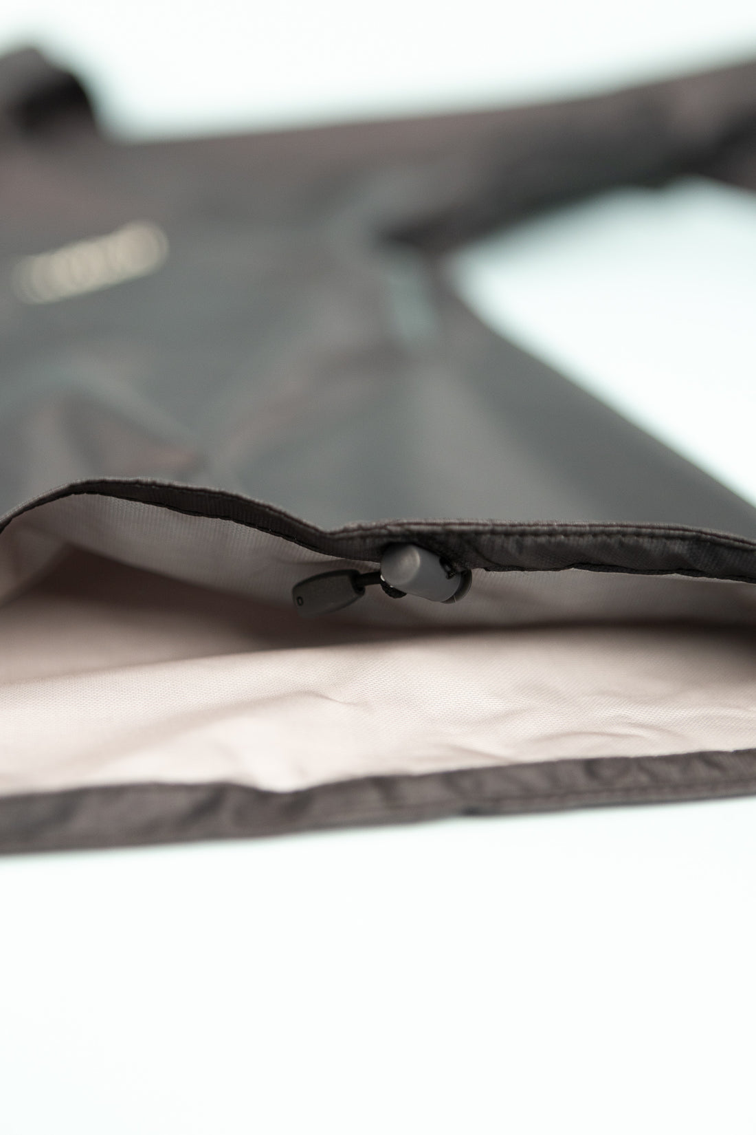 Close-up view of the US Women's Versalite Jacket - Black showcasing the fabric texture and zipper detail.