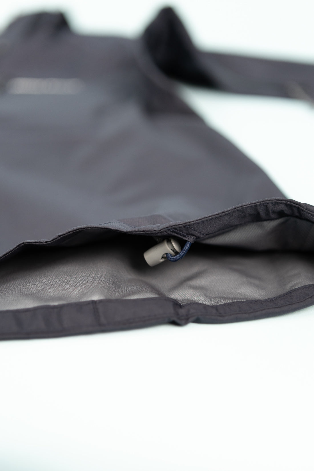 Montbell US Women's Tempest Jacket showing interior details and fabric quality in navy color.