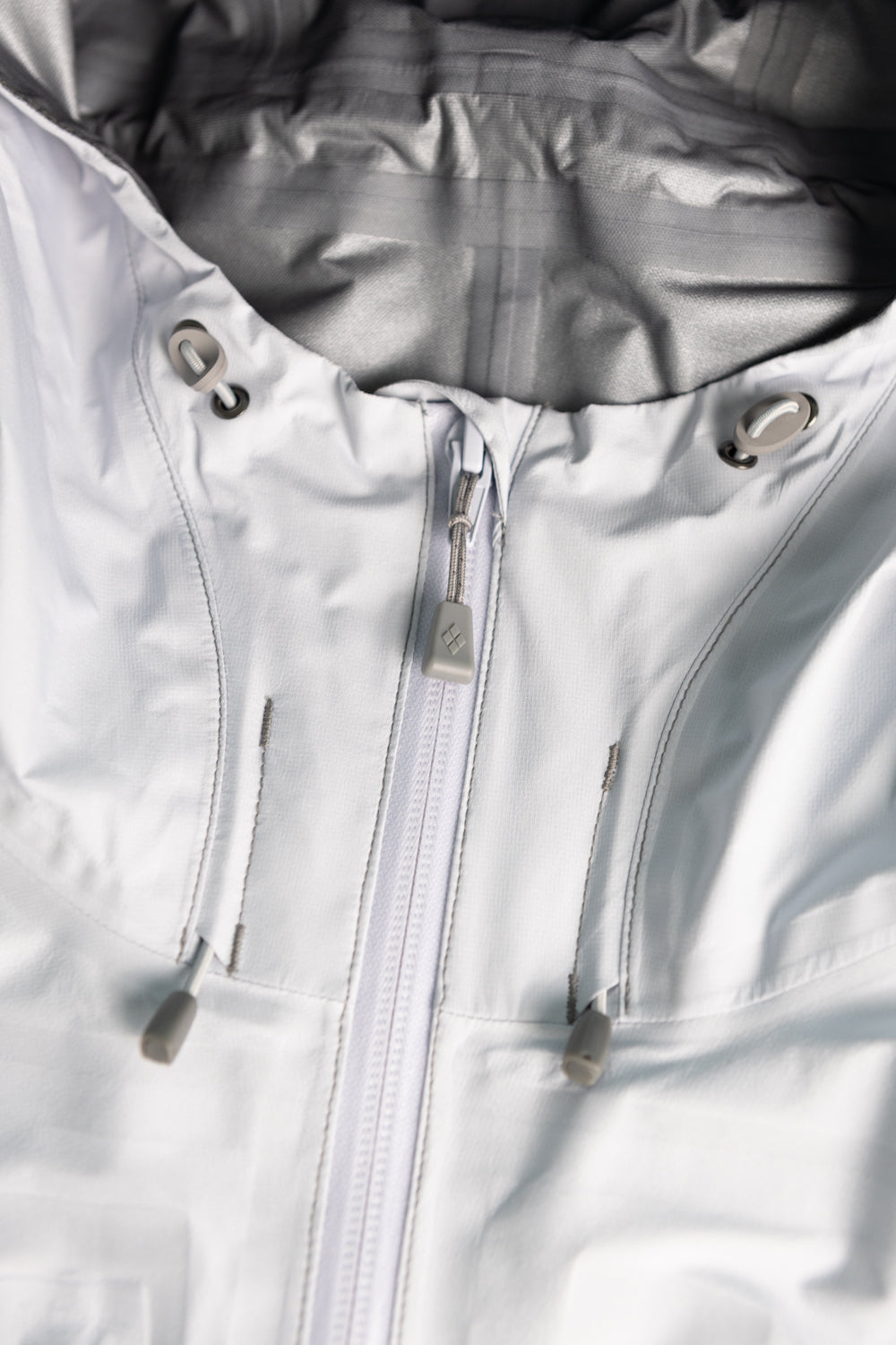 Montbell US Women's Tempest Jacket - Light Blue close-up of hood and zipper design.