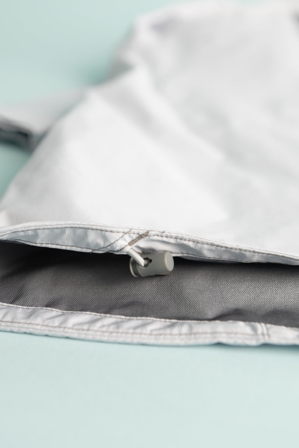 Montbell US Women's Tempest Jacket - Light Blue zipper detail on a stylish and functional ultralight rain jacket