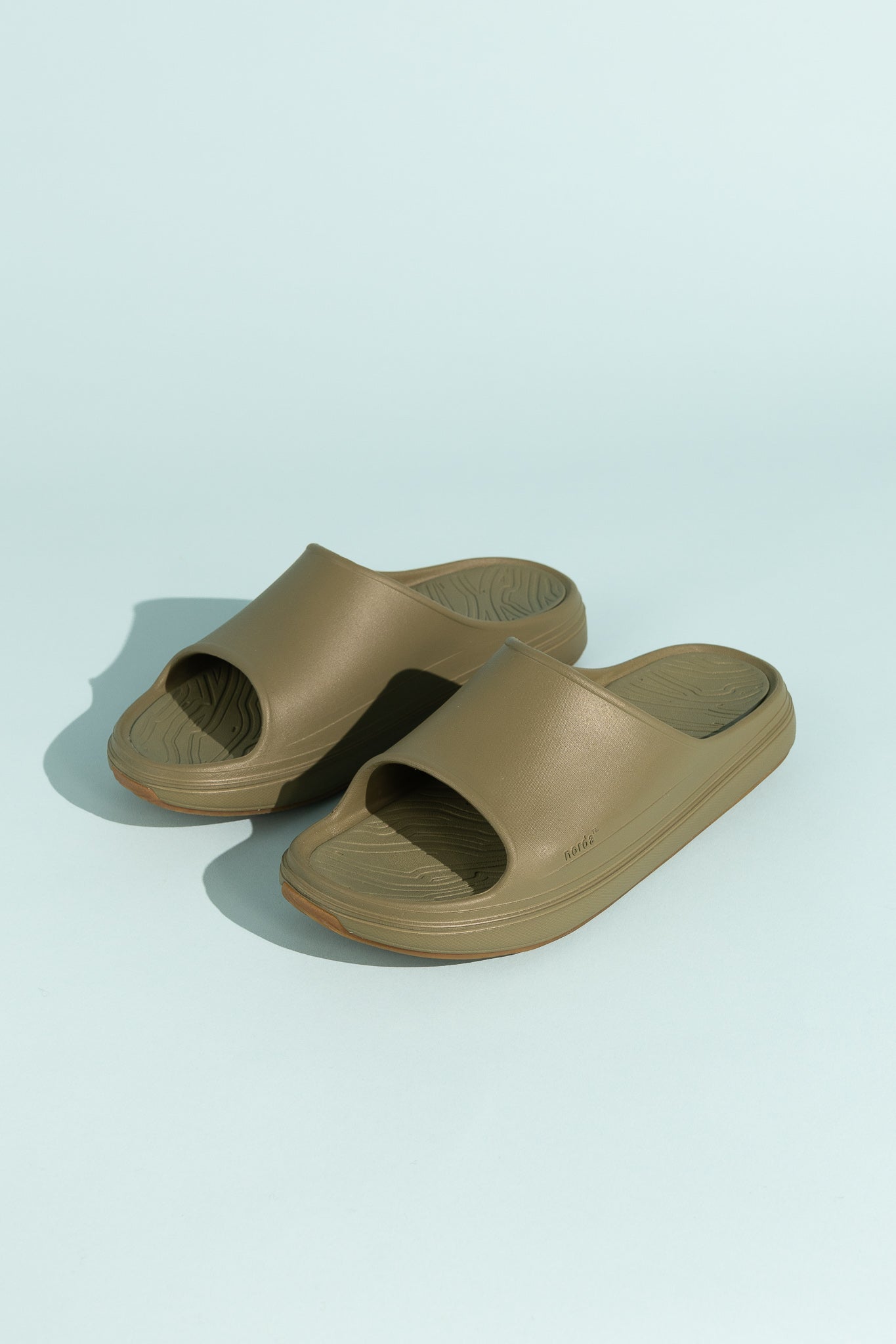 Norda 008 - Sage recovery slide in a soft brown color, designed for comfort and support.