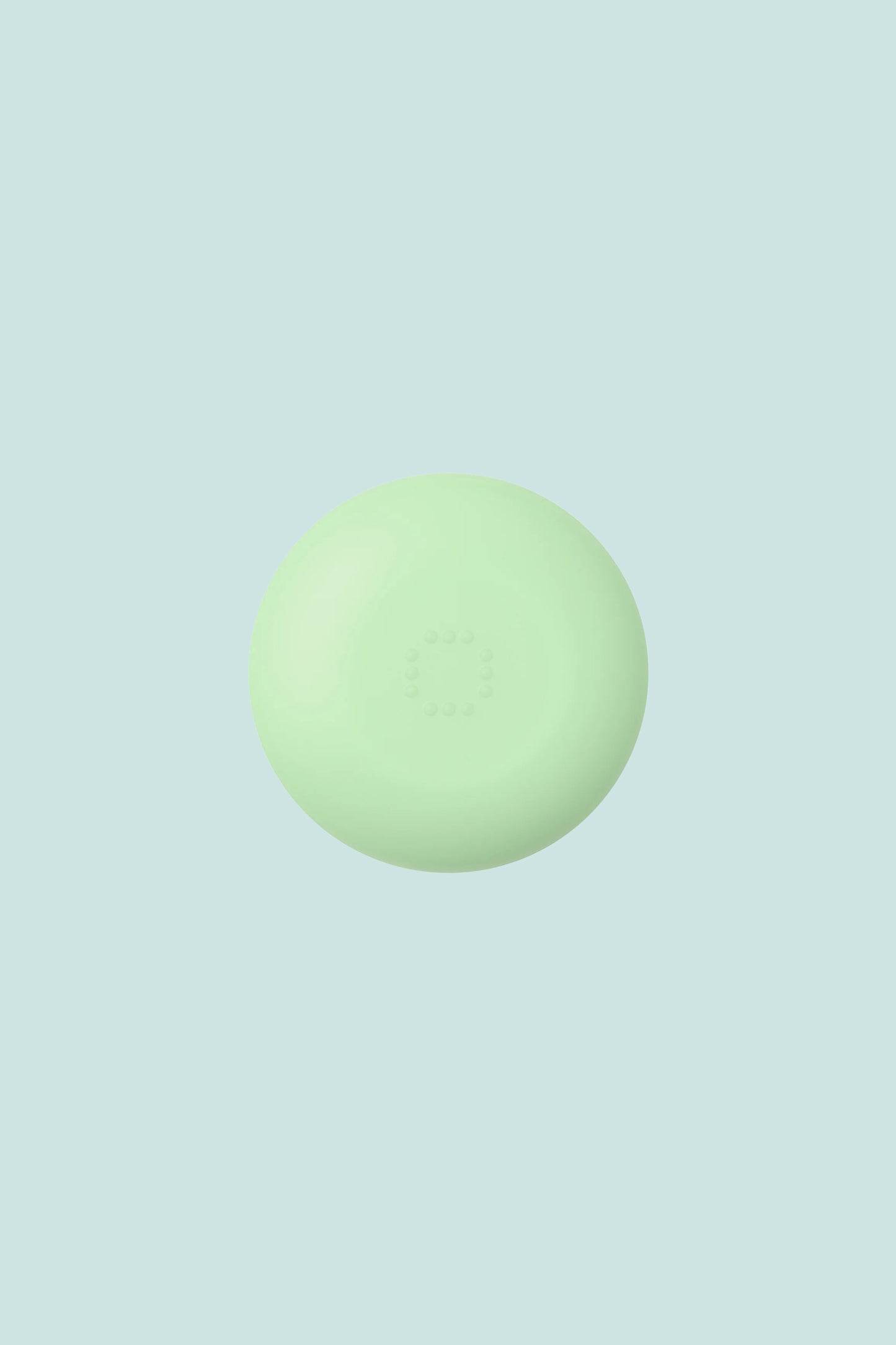 OEM Nourishing Lip Balm - Menthol in a green circular container on a light background