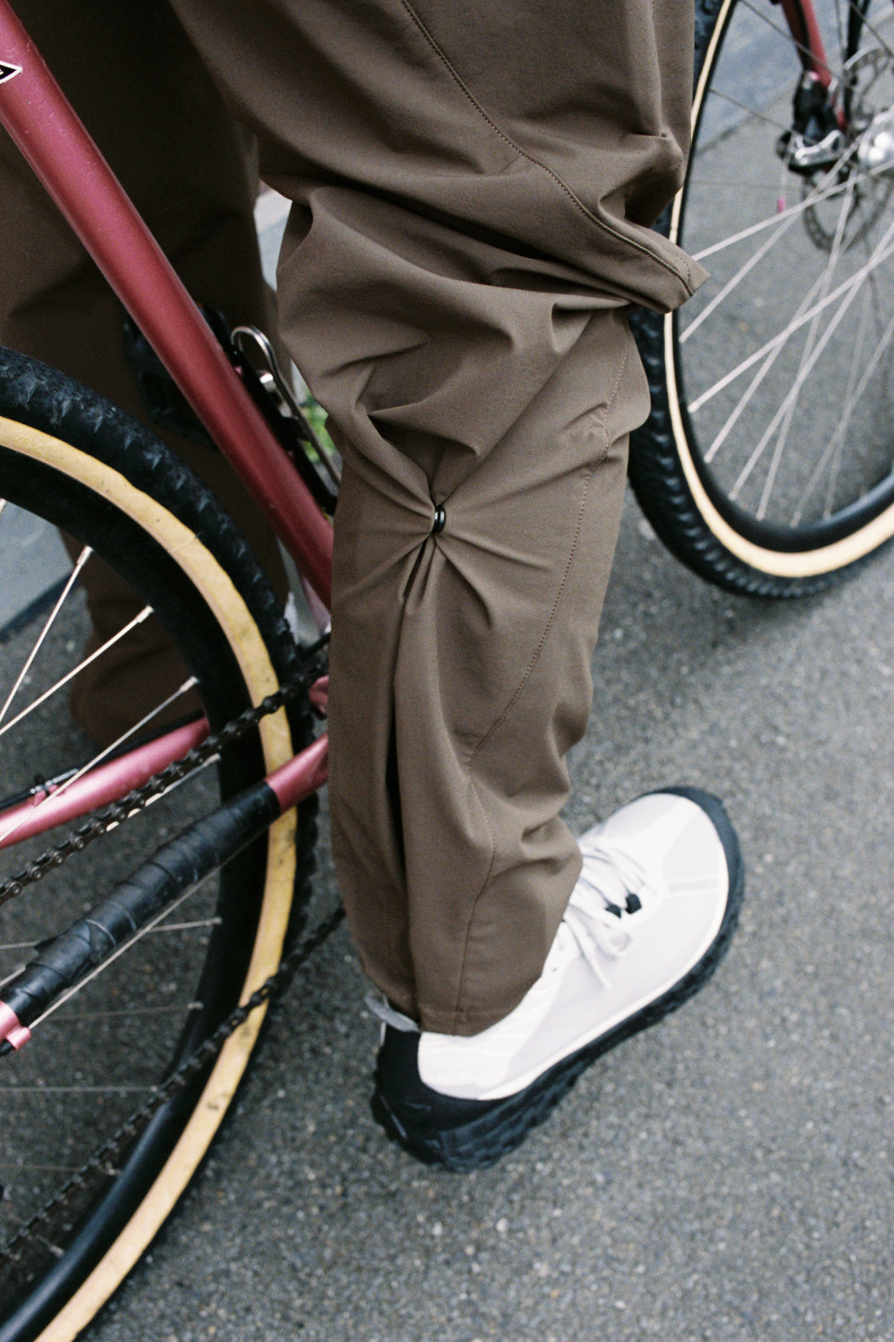 Portal Traka Softshell Pant - Slate Black worn while cycling, showcasing flexibility and comfort in an active lifestyle.