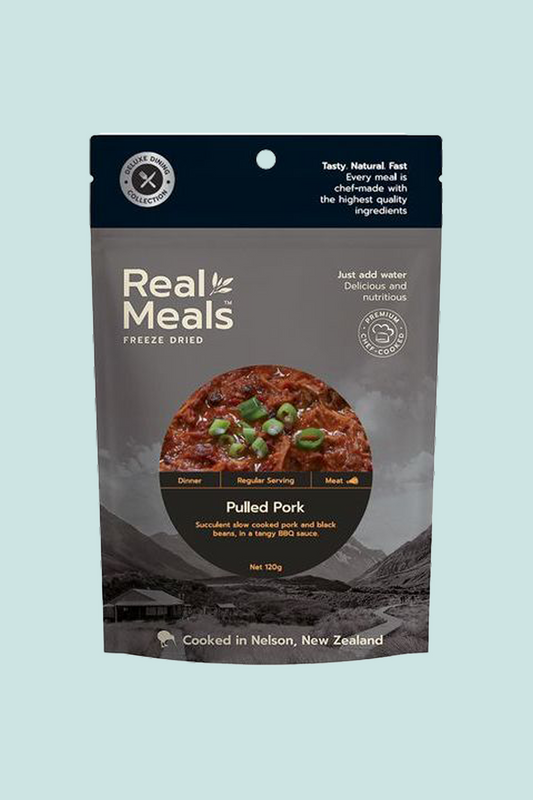 Real Meals Pulled Pork freeze-dried meal package featuring succulent pork and black beans in BBQ sauce.