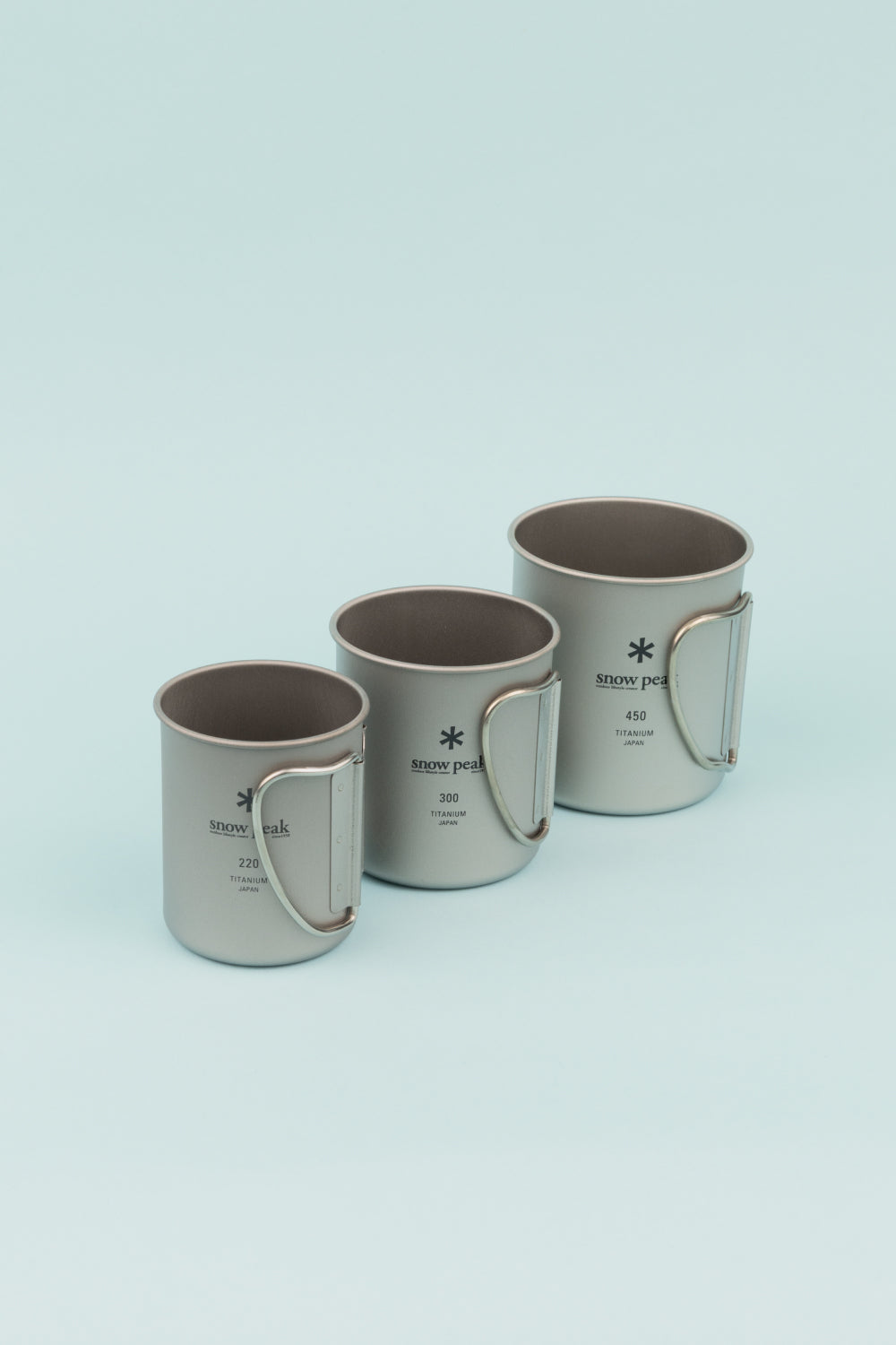 Snow Peak Single Wall Titanium Nesting Cup Set featuring three ultralight titanium mugs.