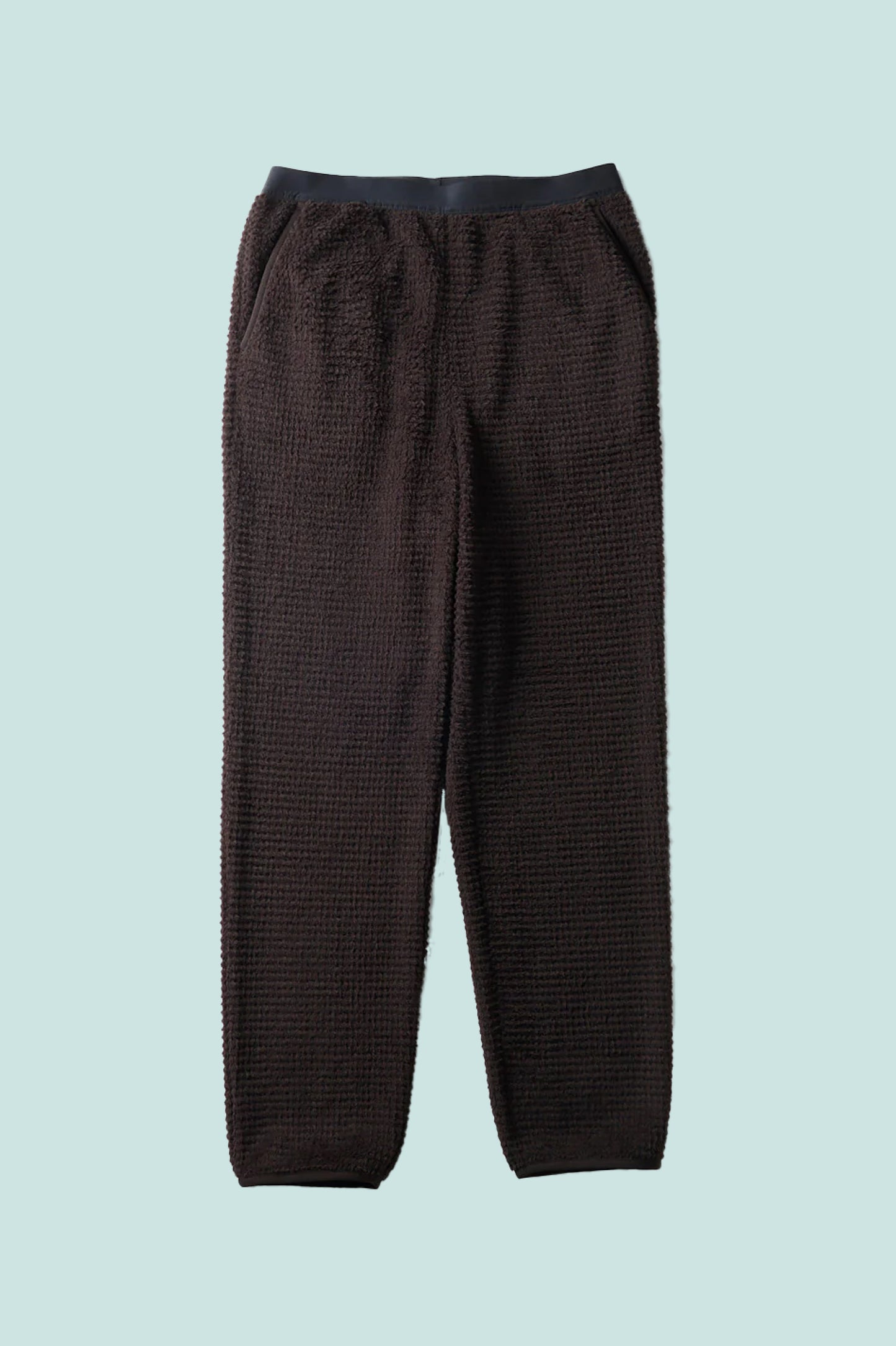 Snow Peak Polartec Alpha Direct Thermo Control Pants in dark brown with textured fabric for warmth and breathability.