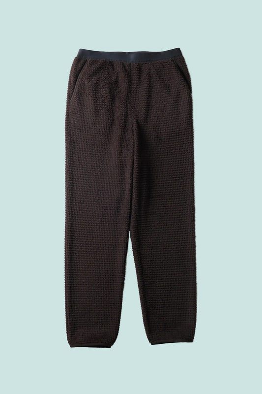 Snow Peak Polartec Alpha Direct Thermo Control Pants in dark brown with textured fabric for warmth and breathability.