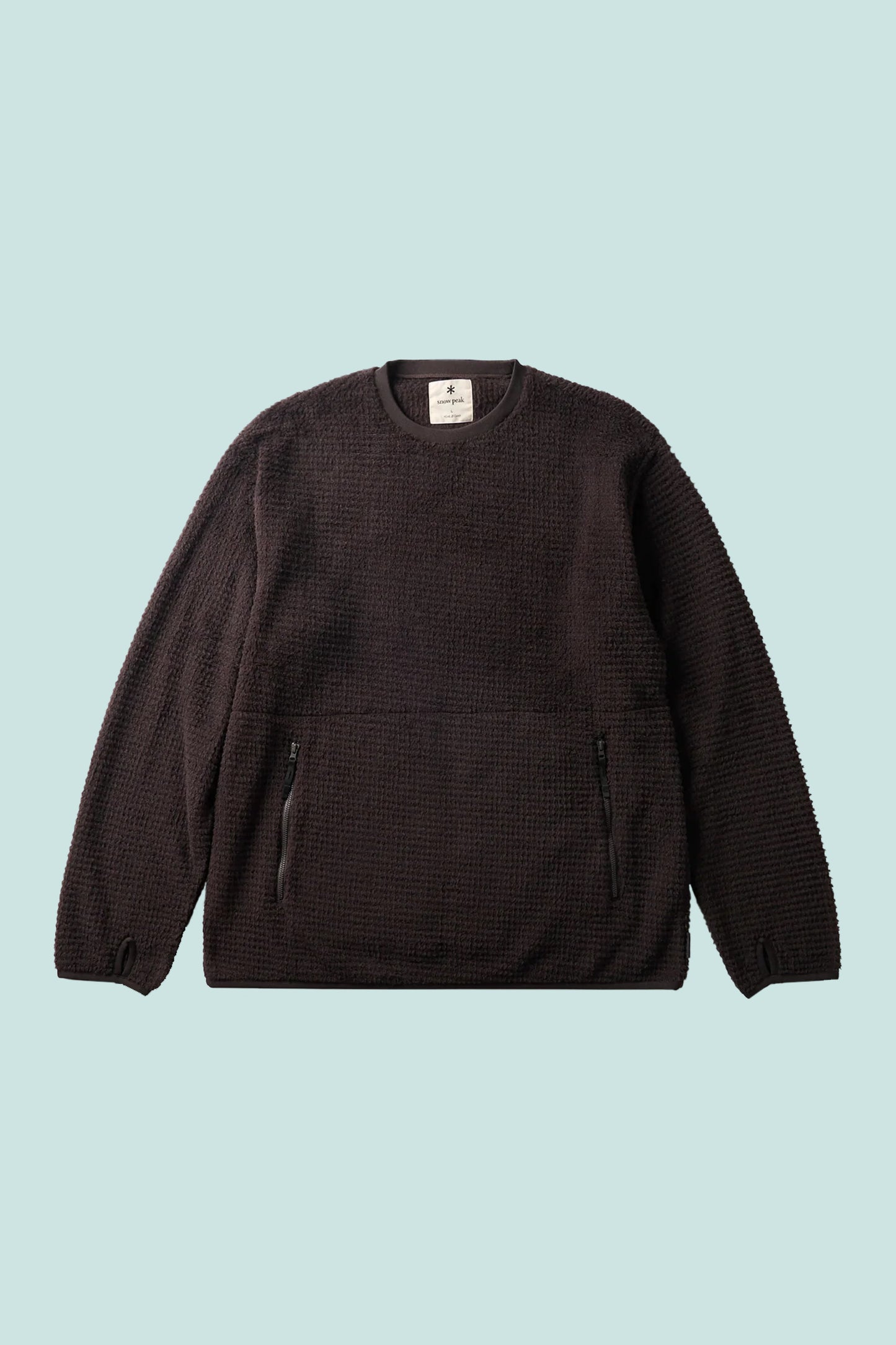 Snow Peak Polartec Alpha Direct Thermo Control Pullover - Dark Brown on a light blue background.