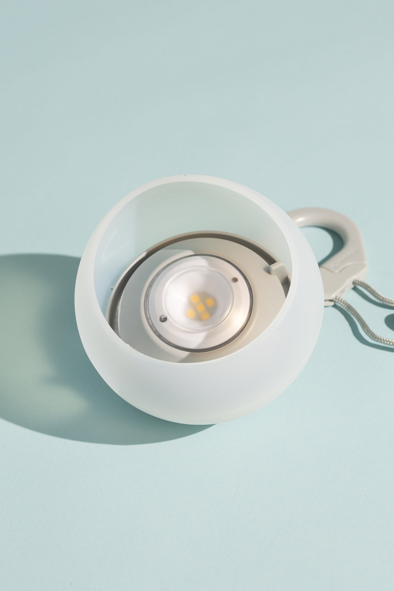 Snow Peak Rechargeable Hozuki Lantern - Twilight on a light blue background.